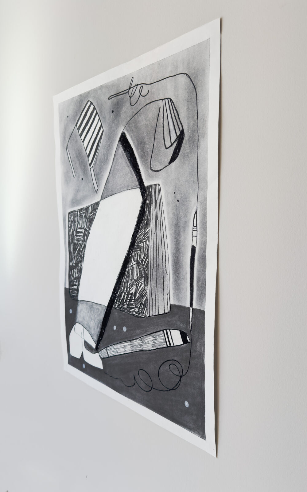 A monochromatic drawing of a still life featuring a striped chair, a book, and a pen on a gray background.