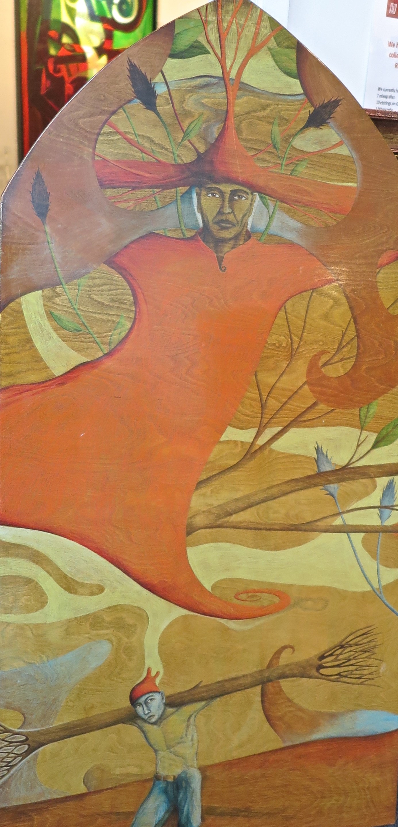 A painting of a man holding a broom in front of a tree.