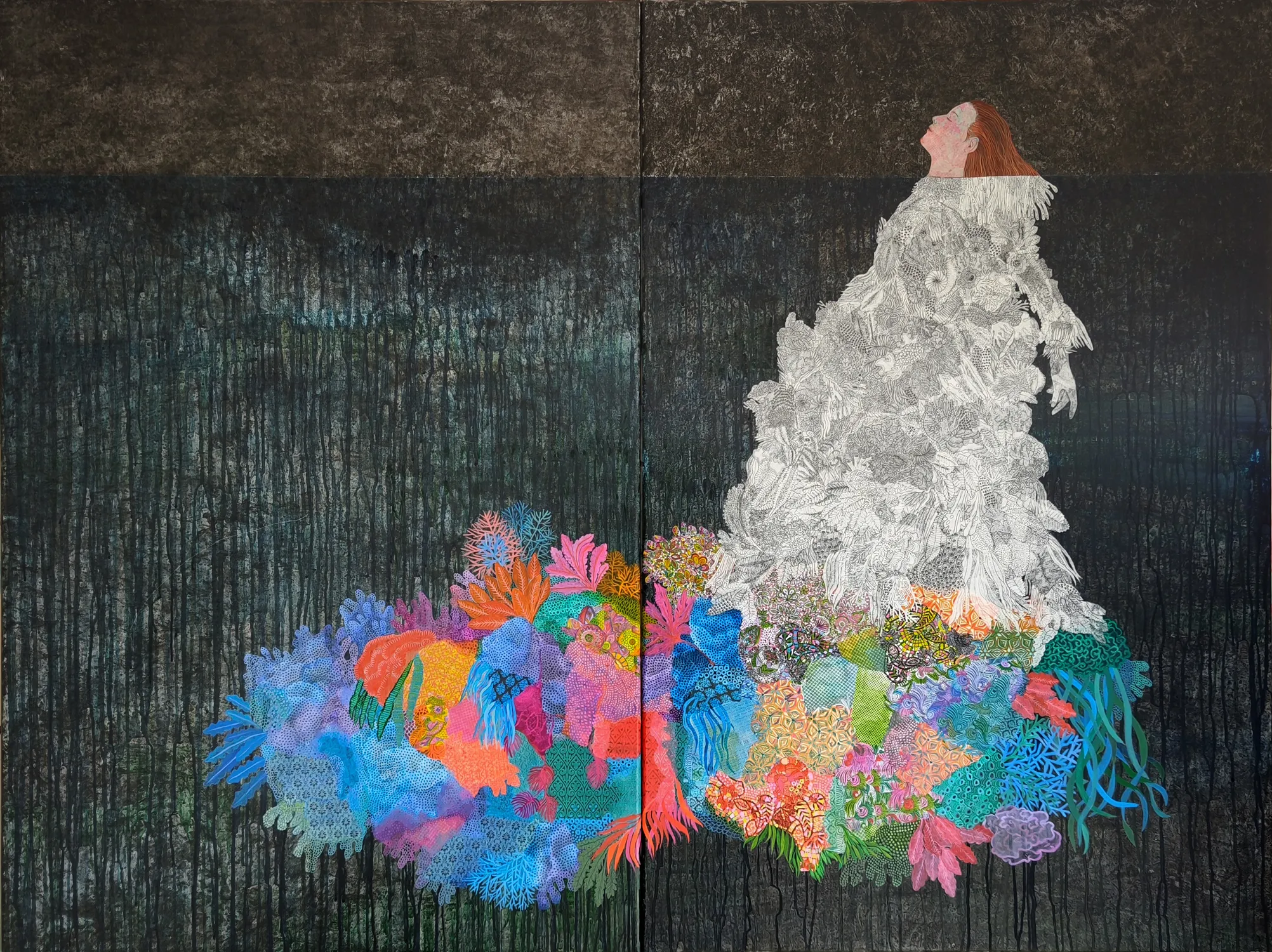 A figure in a white dress stands against a dark background, surrounded by a vibrant explosion of colorful coral-like shapes.