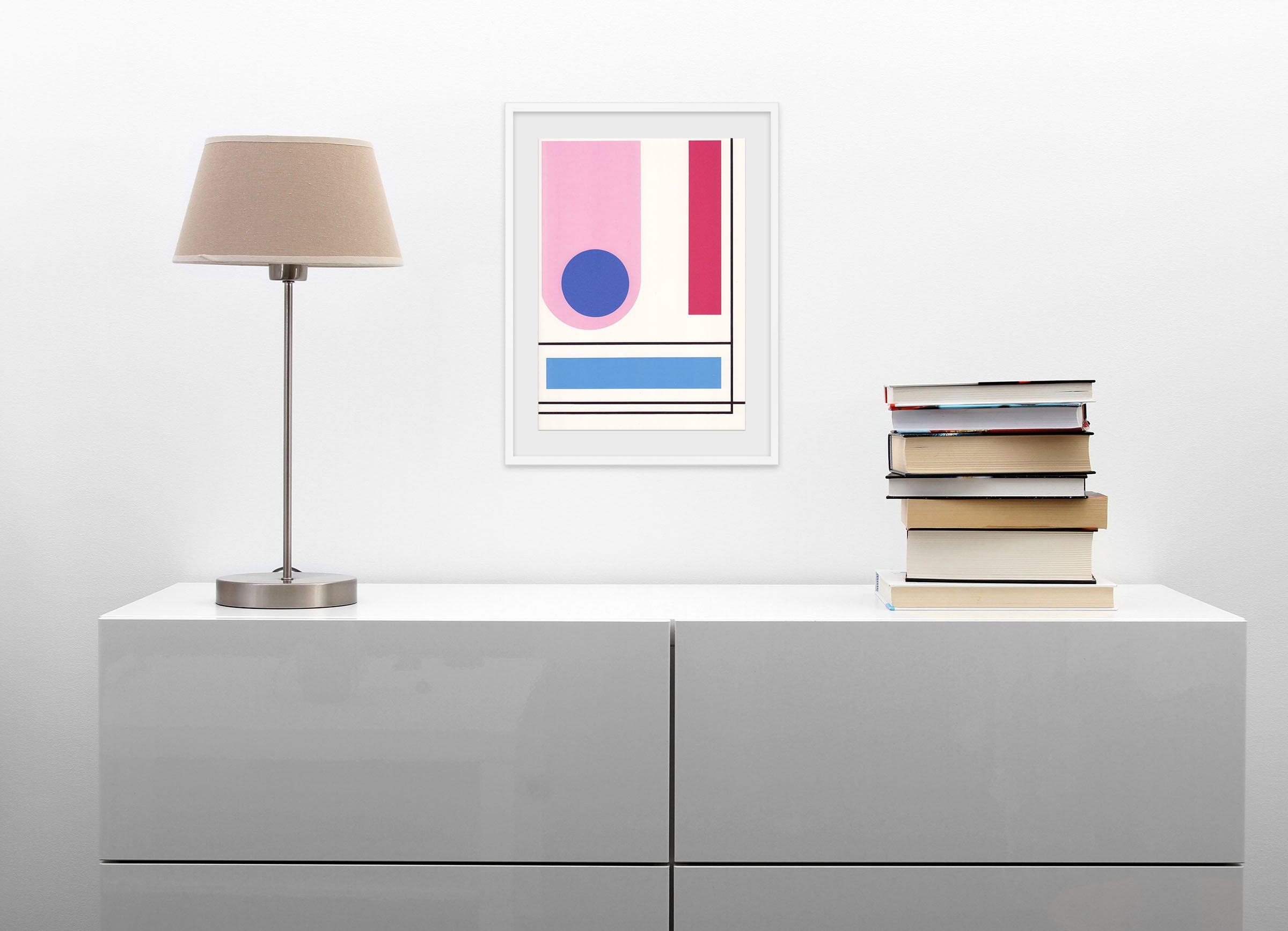 A pink and blue poster with a blue circle in the middle.