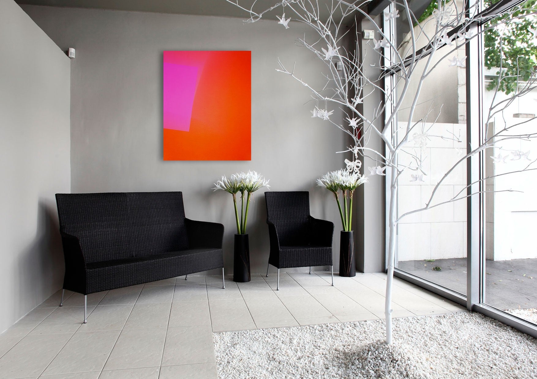 An orange and pink abstract painting on a white background.