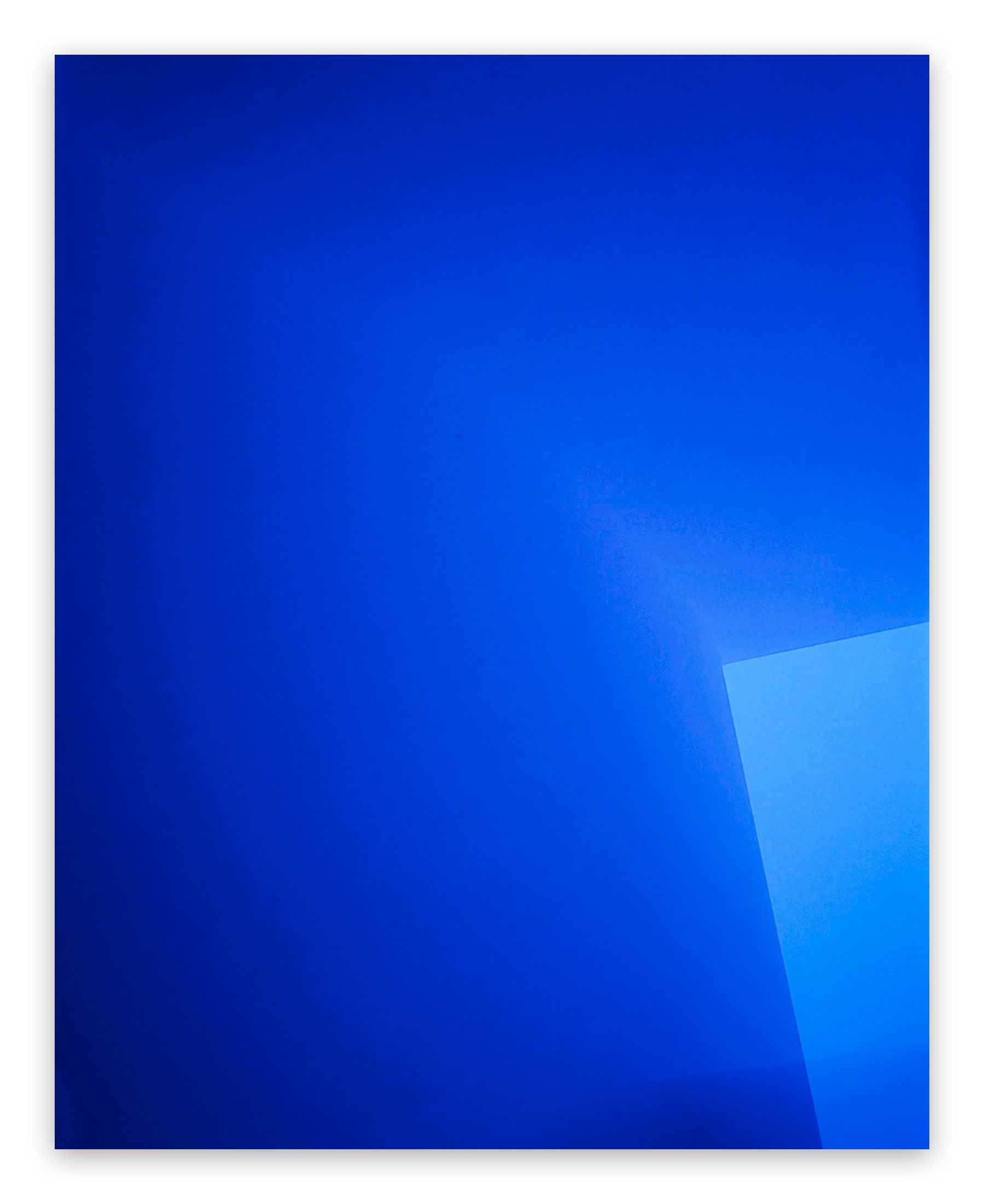 A blue square with a white border on a white background.