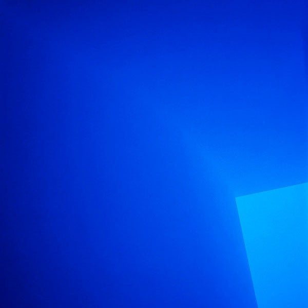 A blue square with a white border on a white background.