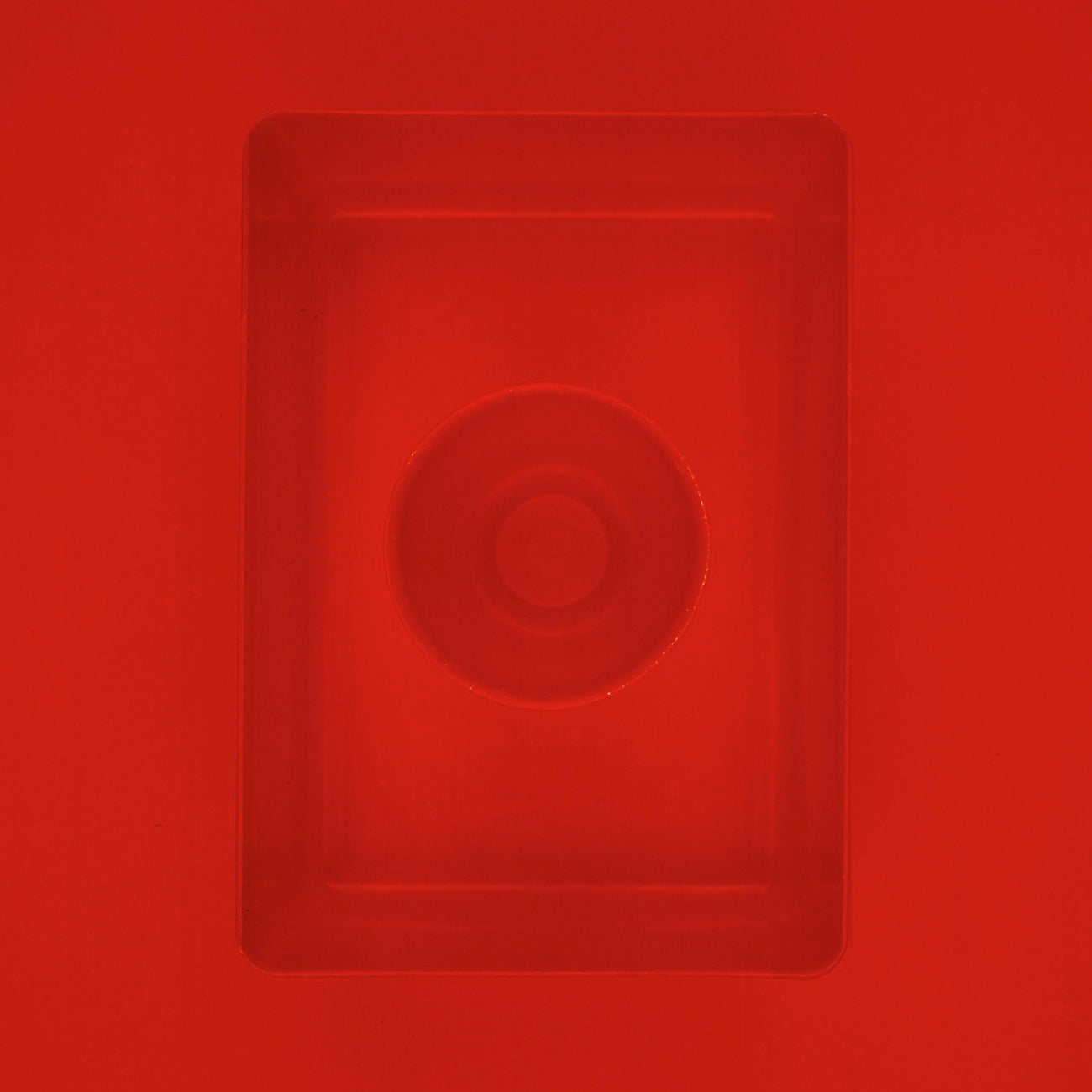 A red square with a circle in the middle of it.