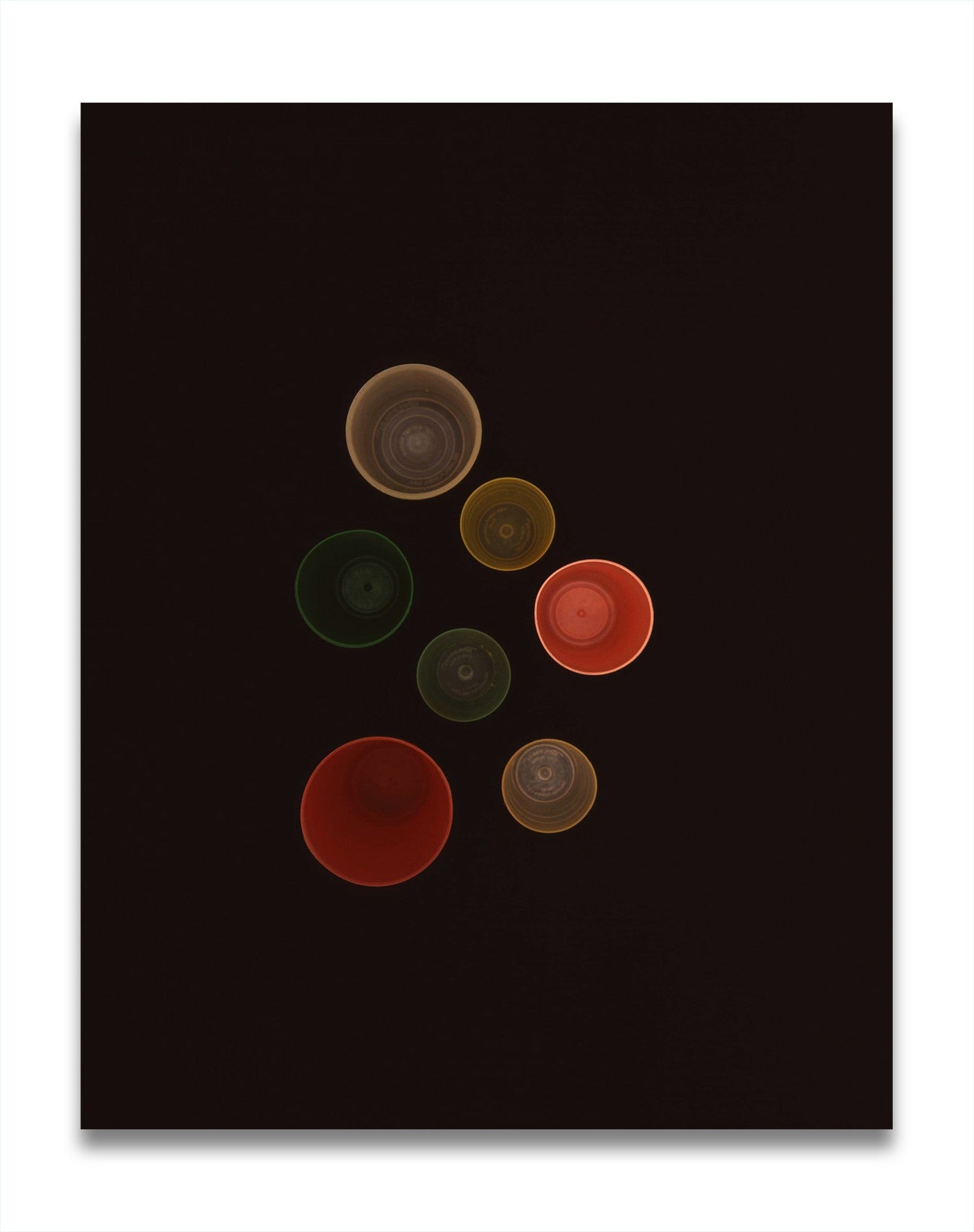 A black background with a bunch of different colored circles.
