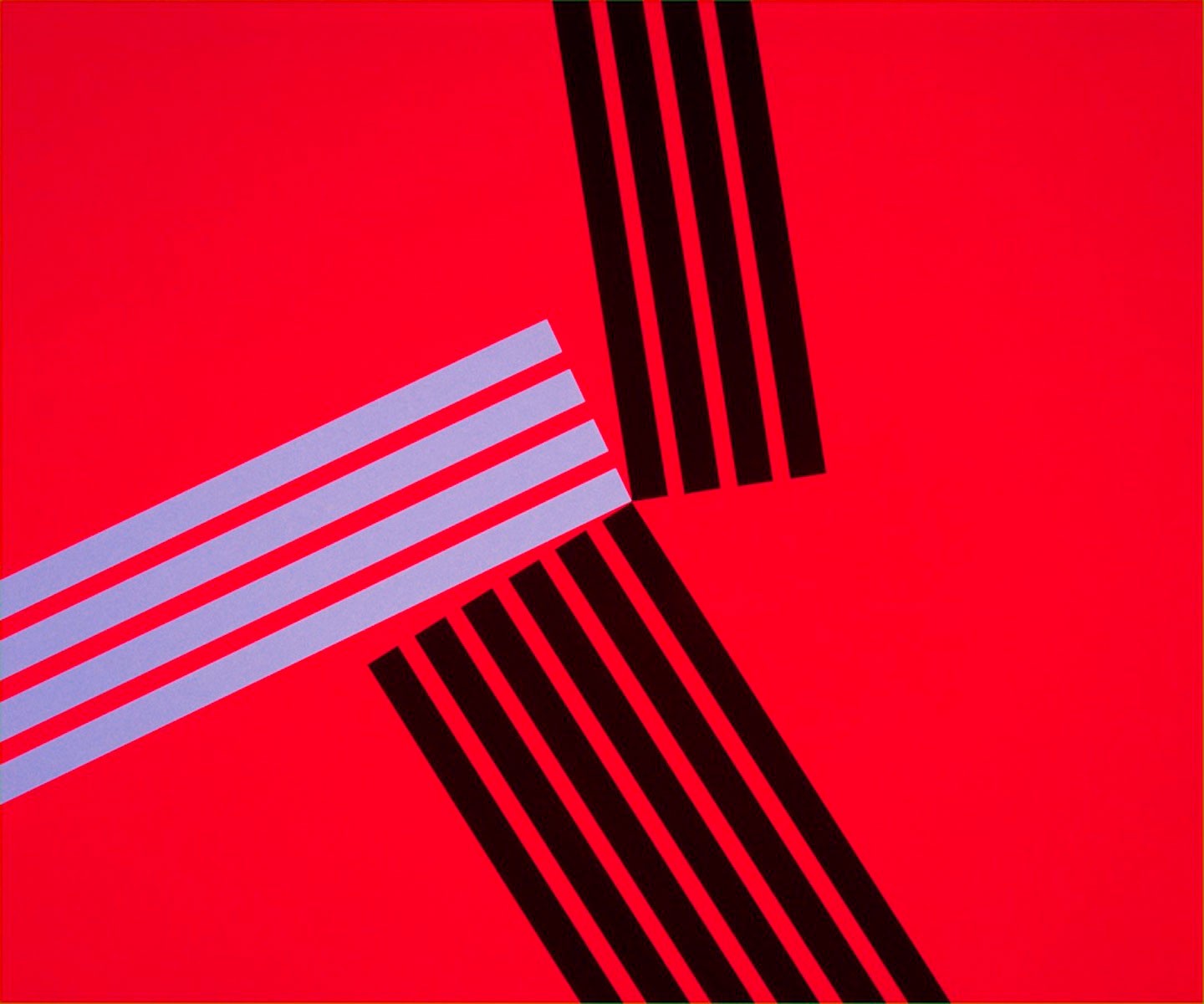 A red square with black and white stripes on it.