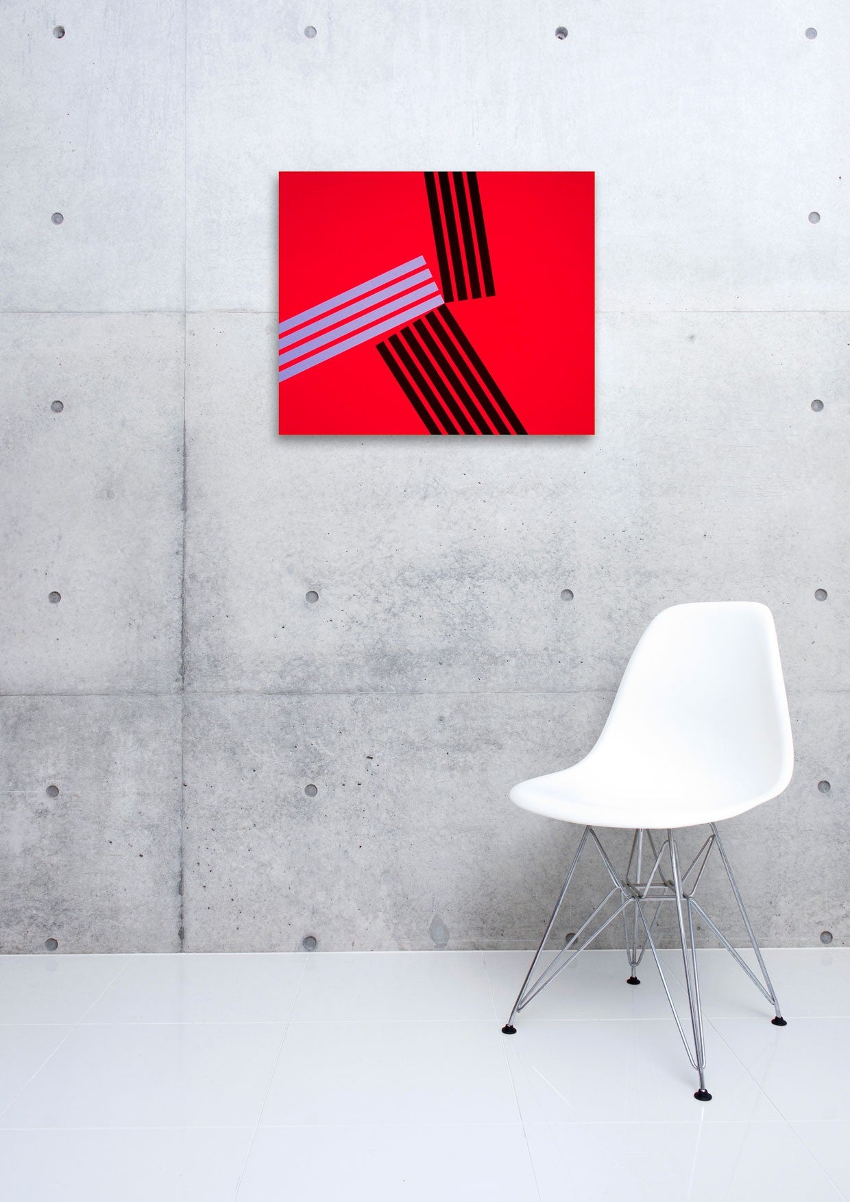 A red square with black and white stripes on it.