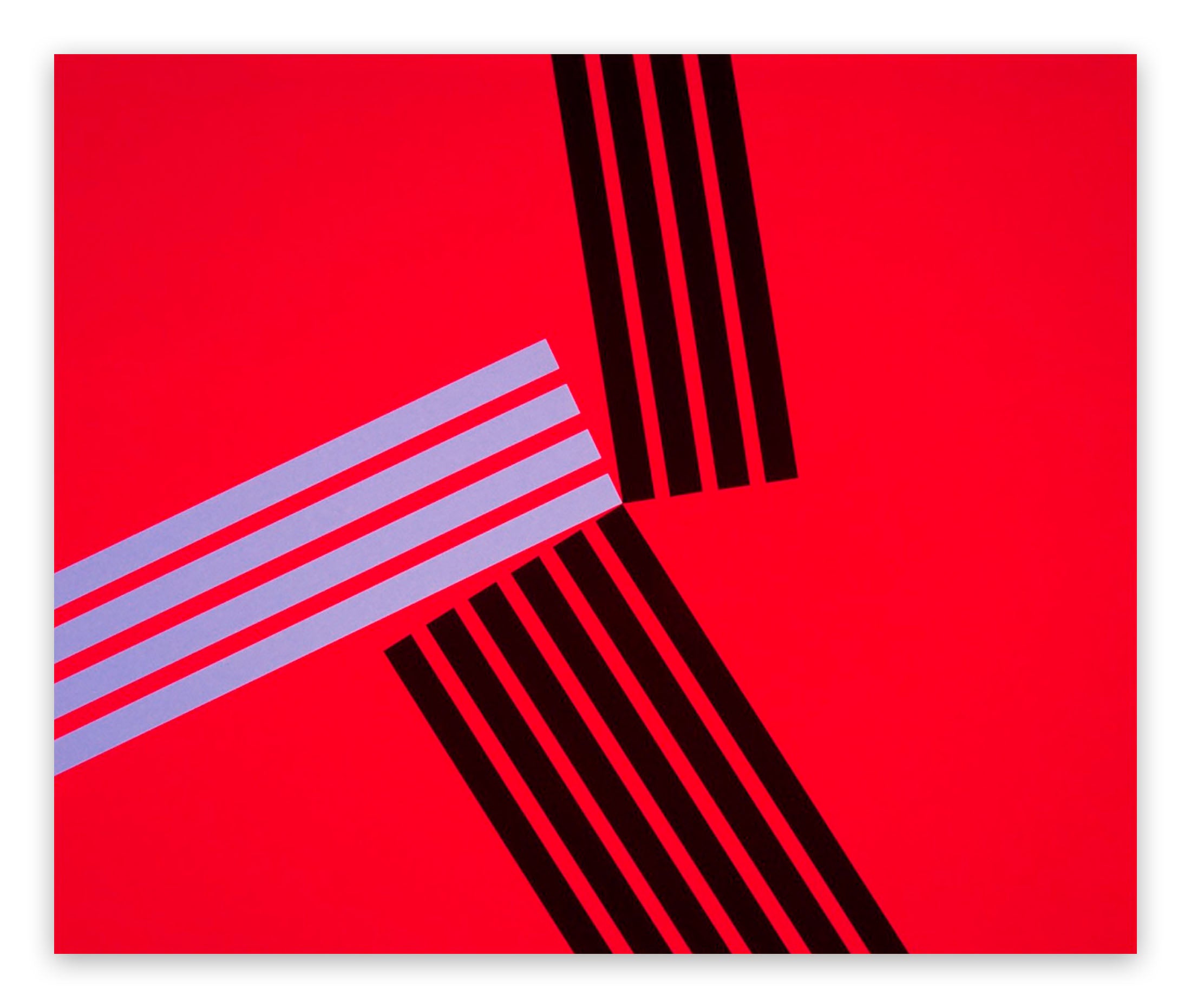 A red square with black and white stripes on it.