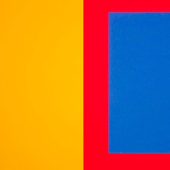 A red, yellow and blue square on a white background.