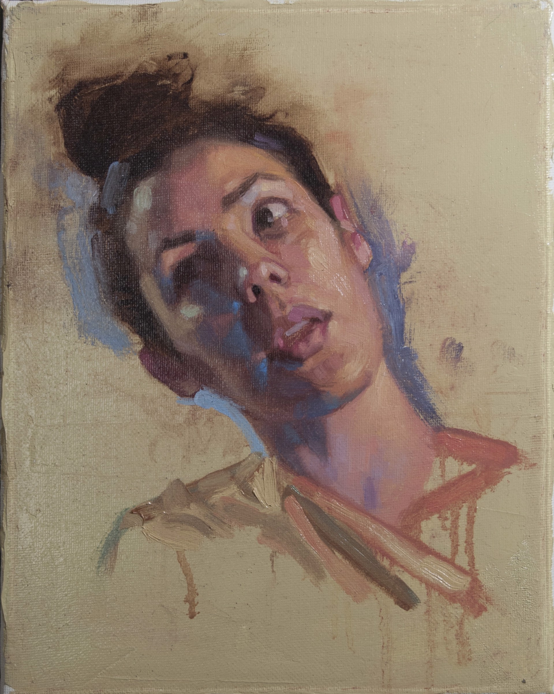A painting of a woman's face on a piece of paper.