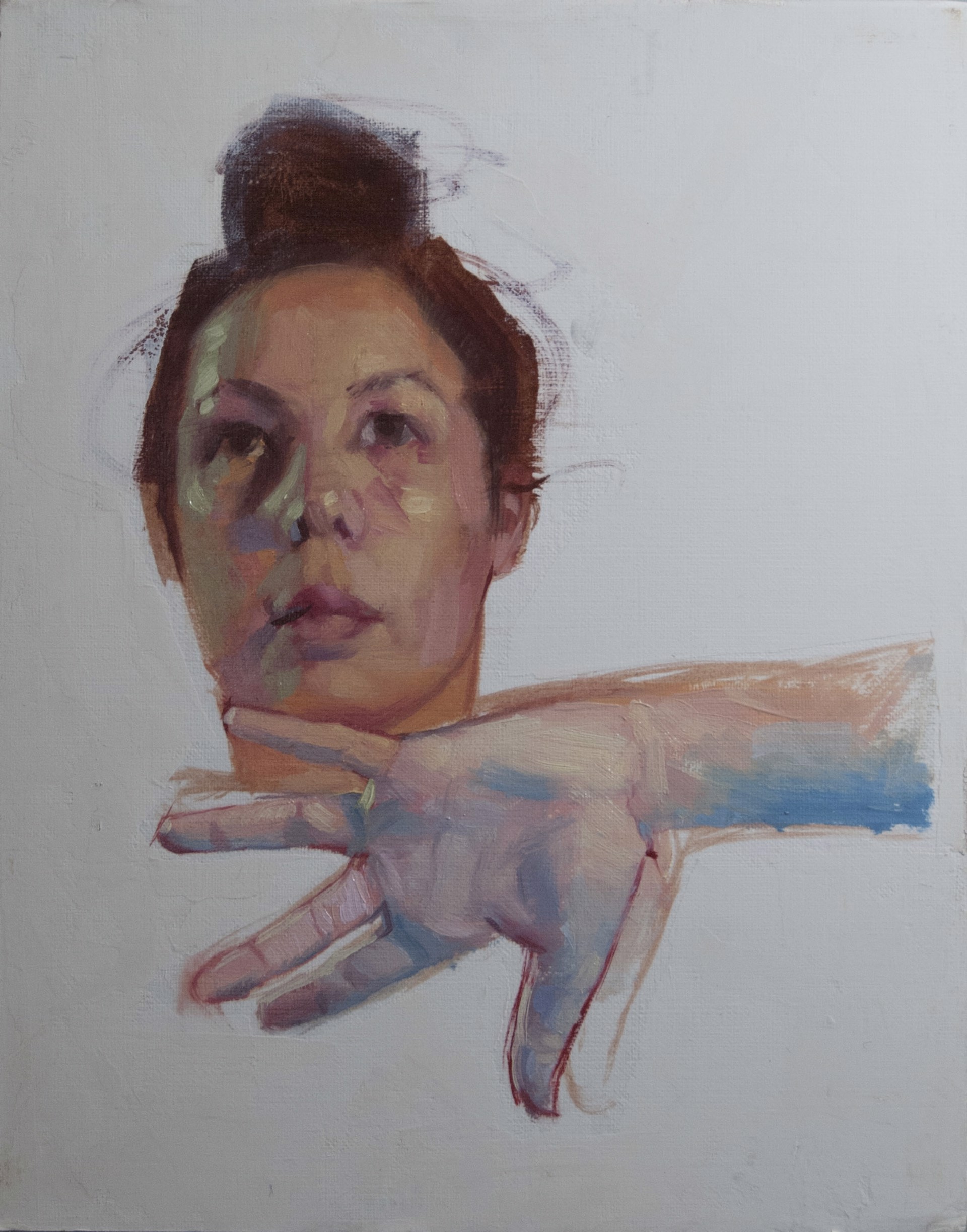 A painting of a woman's face with her hand outstretched.