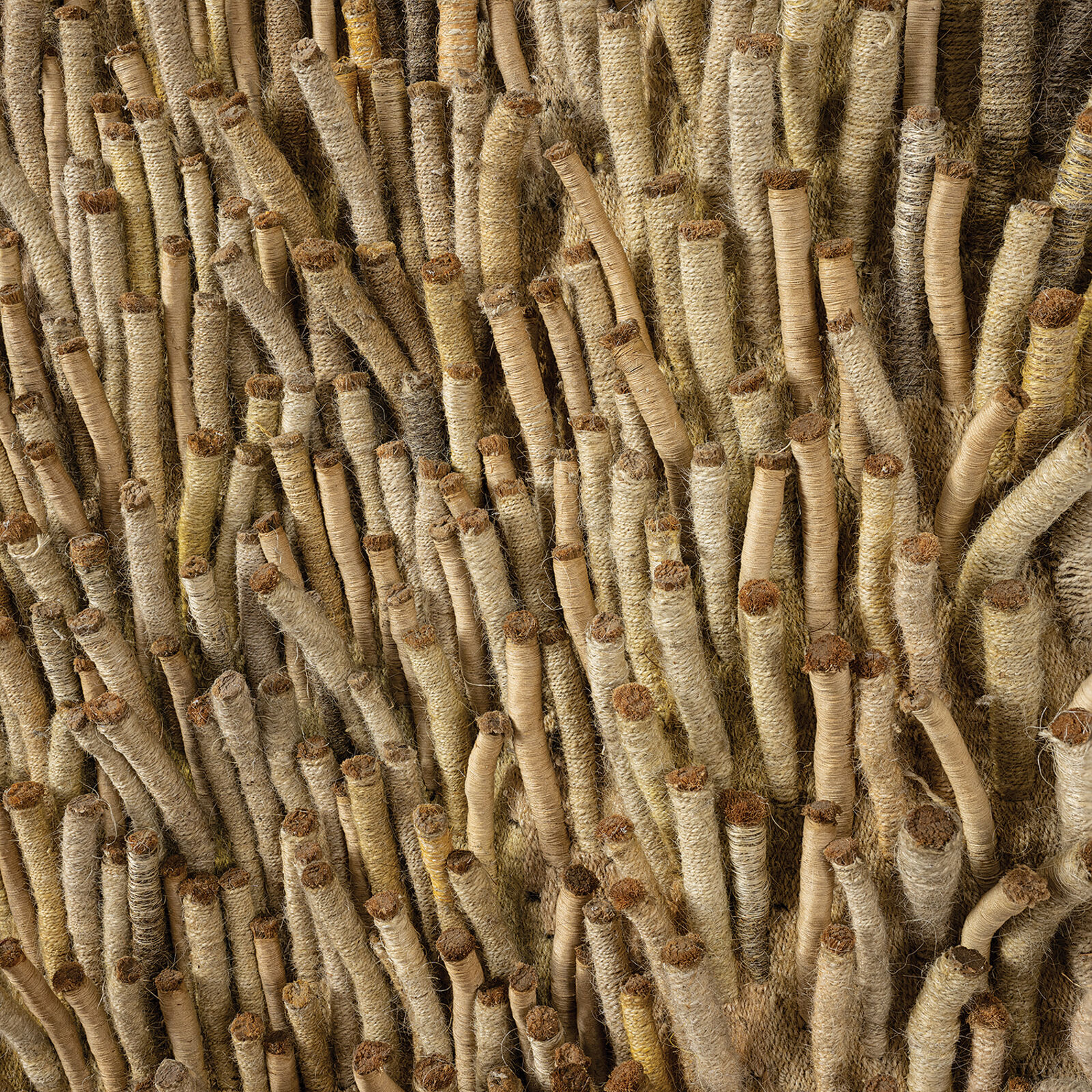 A large piece of art hanging on a wall in a room.