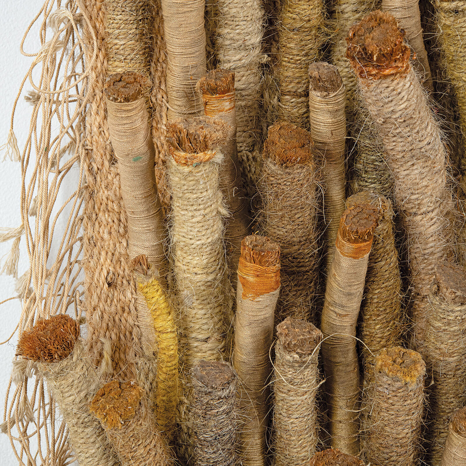 A large piece of art hanging on a wall in a room.