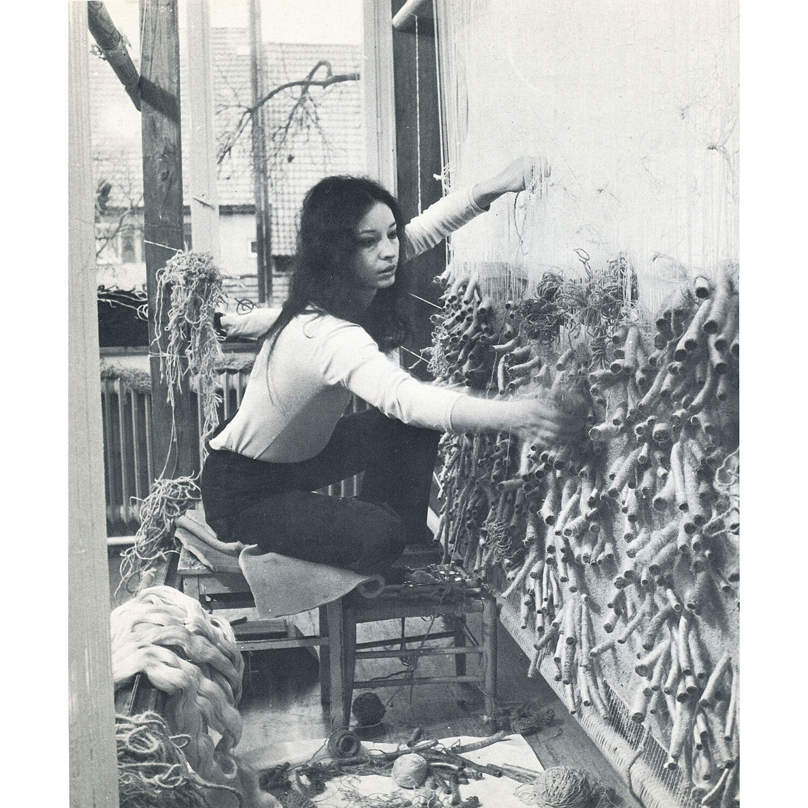 A large piece of art hanging on a wall in a room.