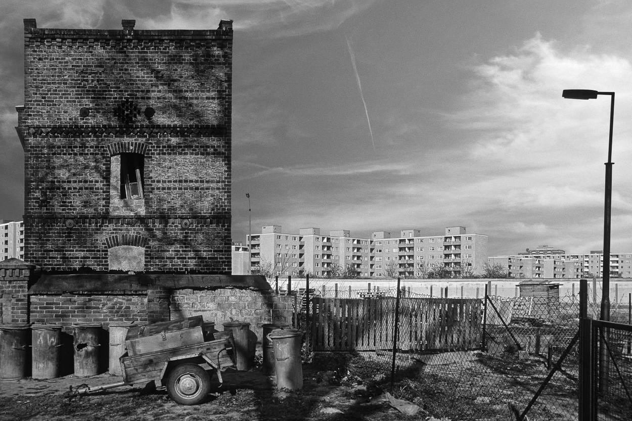 A black and white photo of an old brick building.