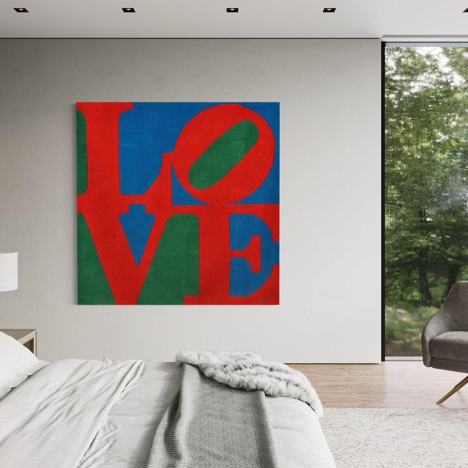 A bold graphic textile featuring large, overlapping letters in primary colors.