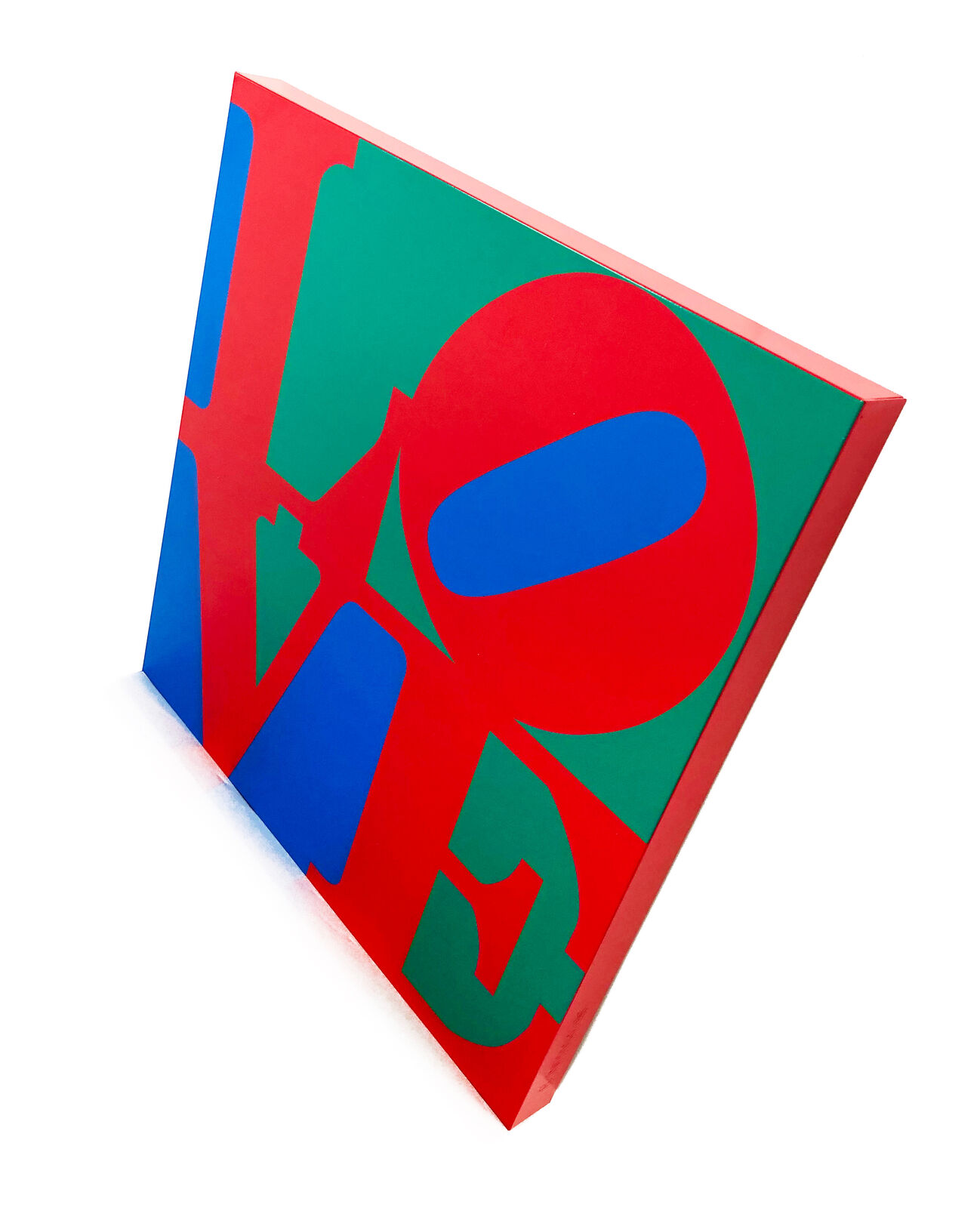 A red, blue and green love sign on a white background.
