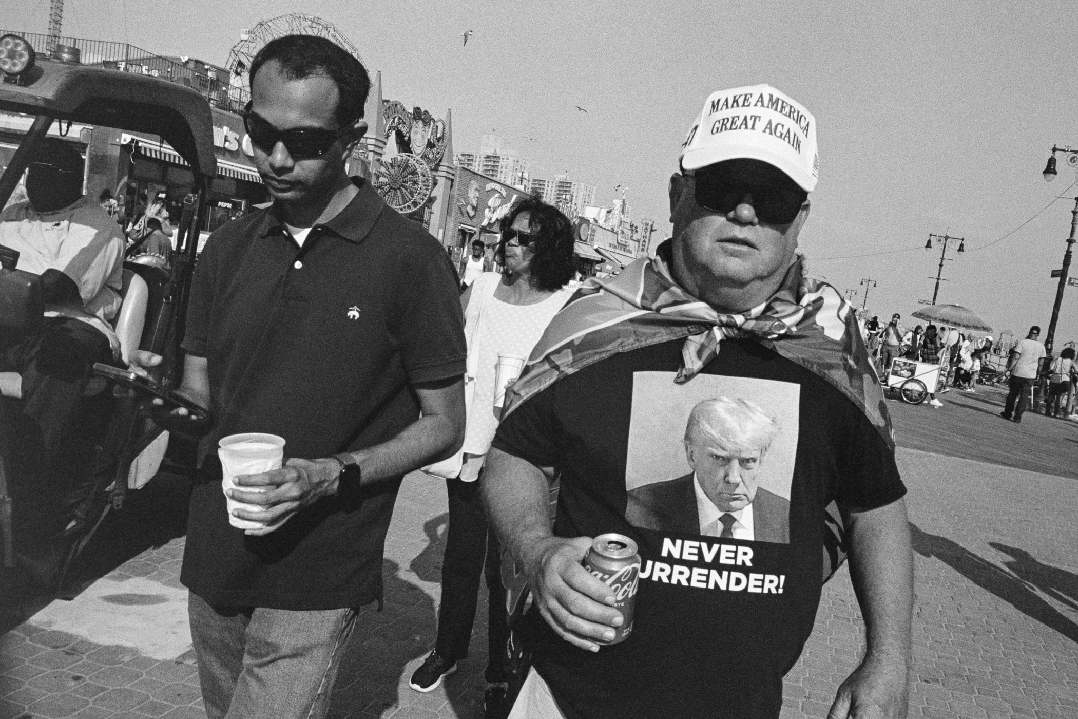 A man wearing a shirt with a picture of President Donald Trump on it.