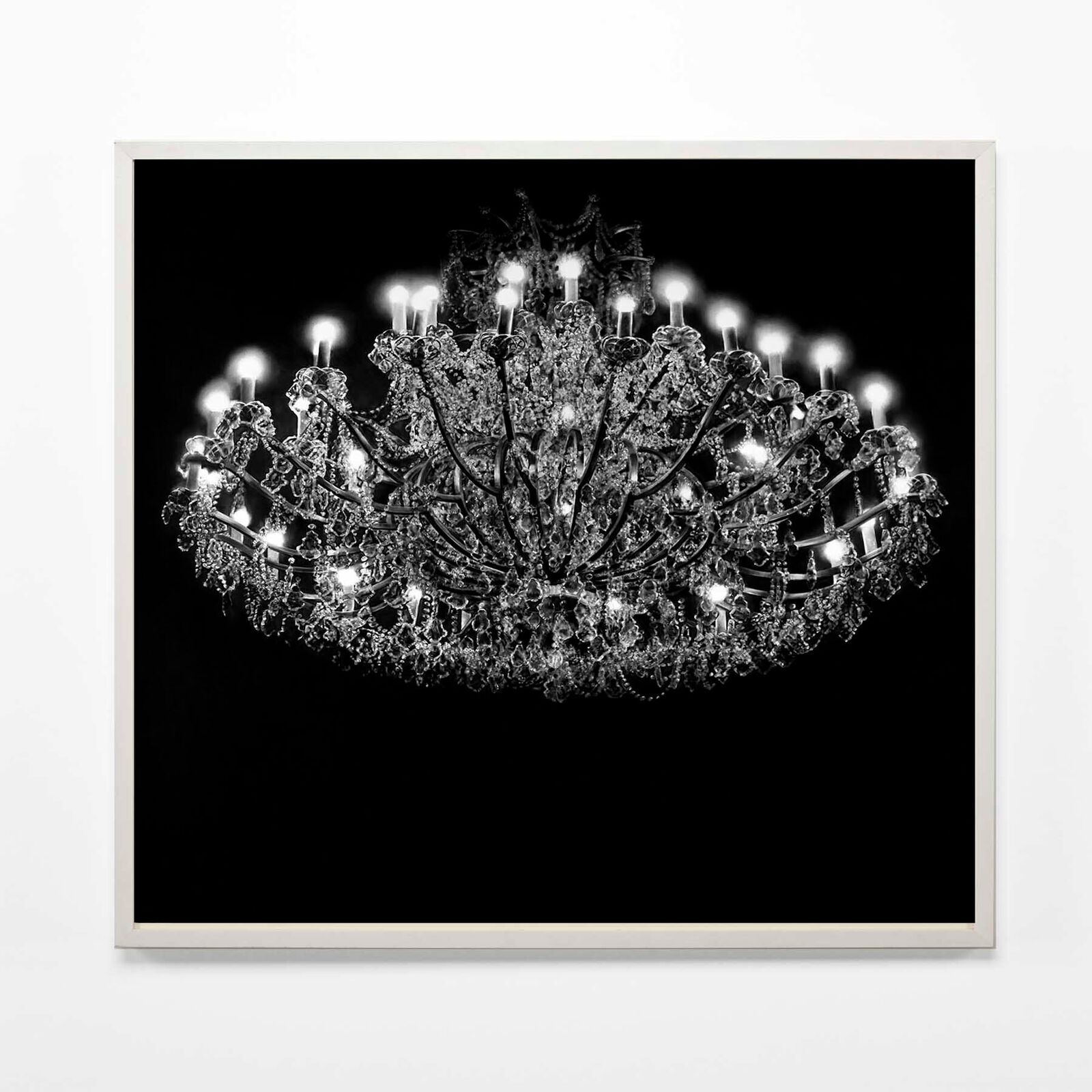 A large chandelier with many lights hanging from the ceiling.