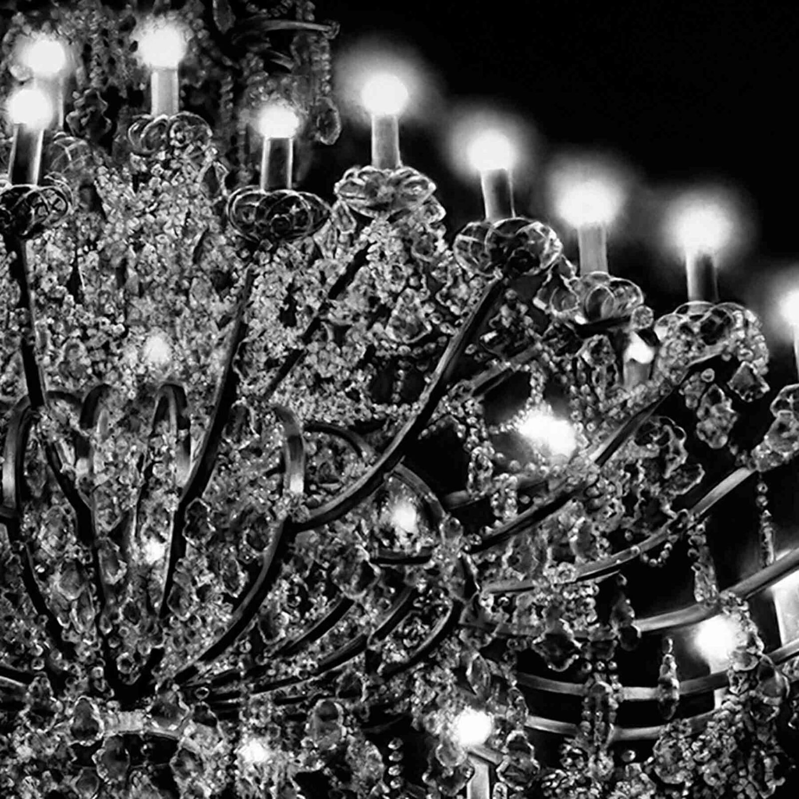 A large chandelier with many lights hanging from the ceiling.