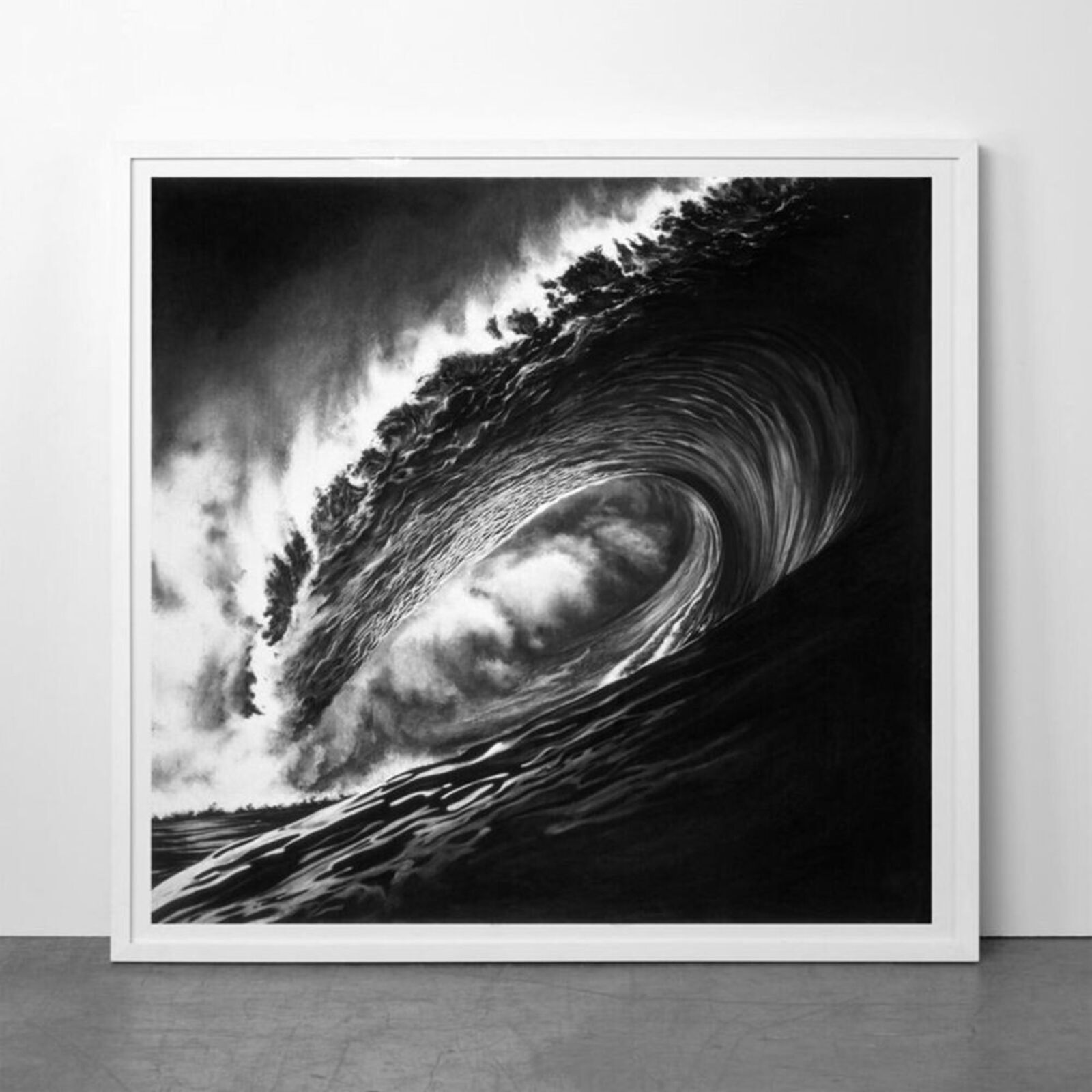 A black and white photo of a large wave in the ocean.