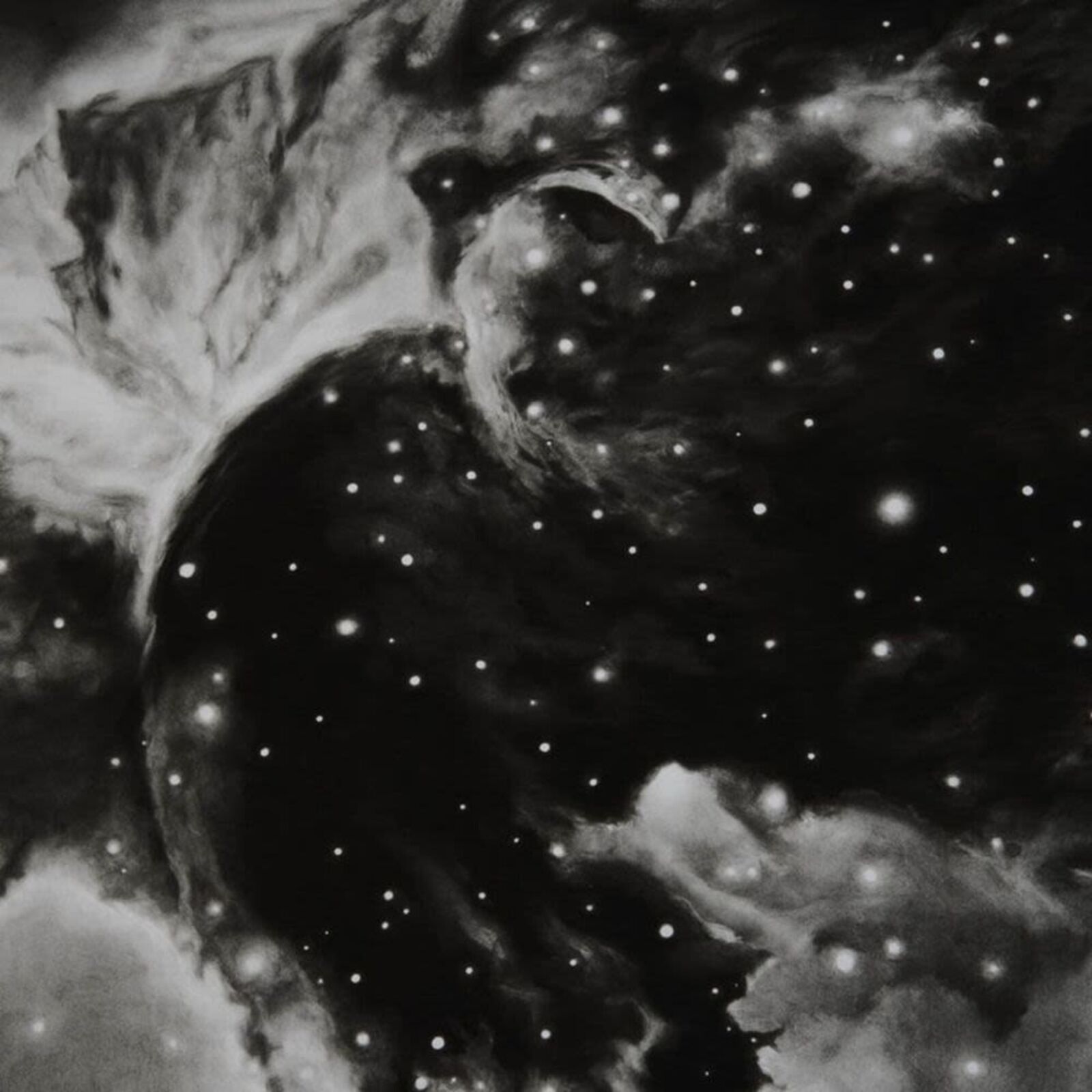 A black and white photograph of a horsehead nebula in a white frame.