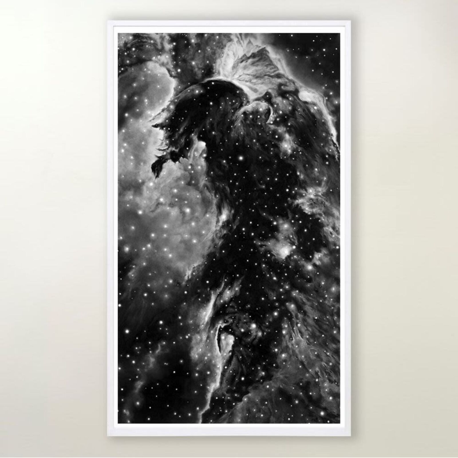 A black and white photograph of a horsehead nebula in a white frame.