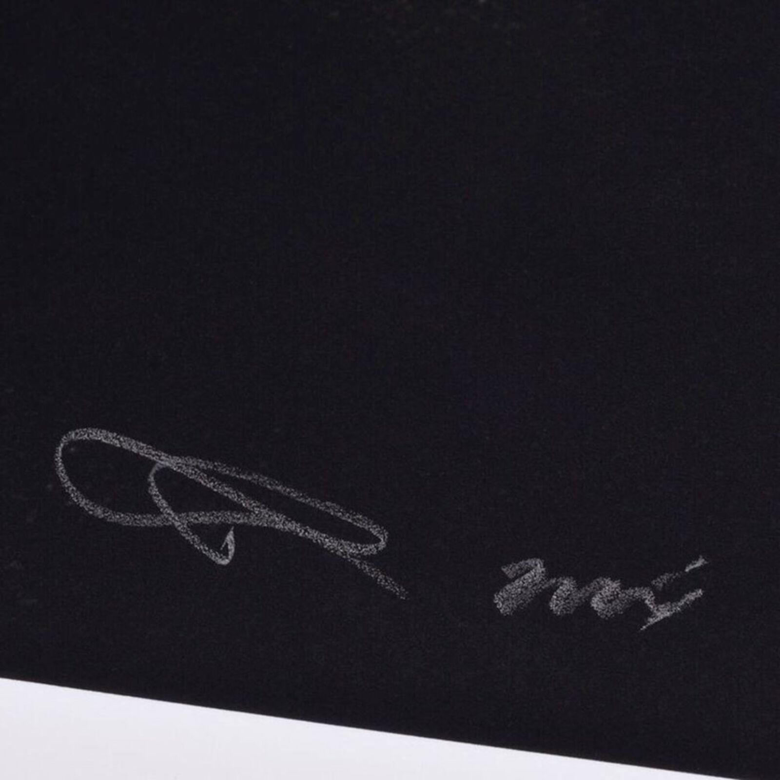 A black and white photo of a door with bars on it.