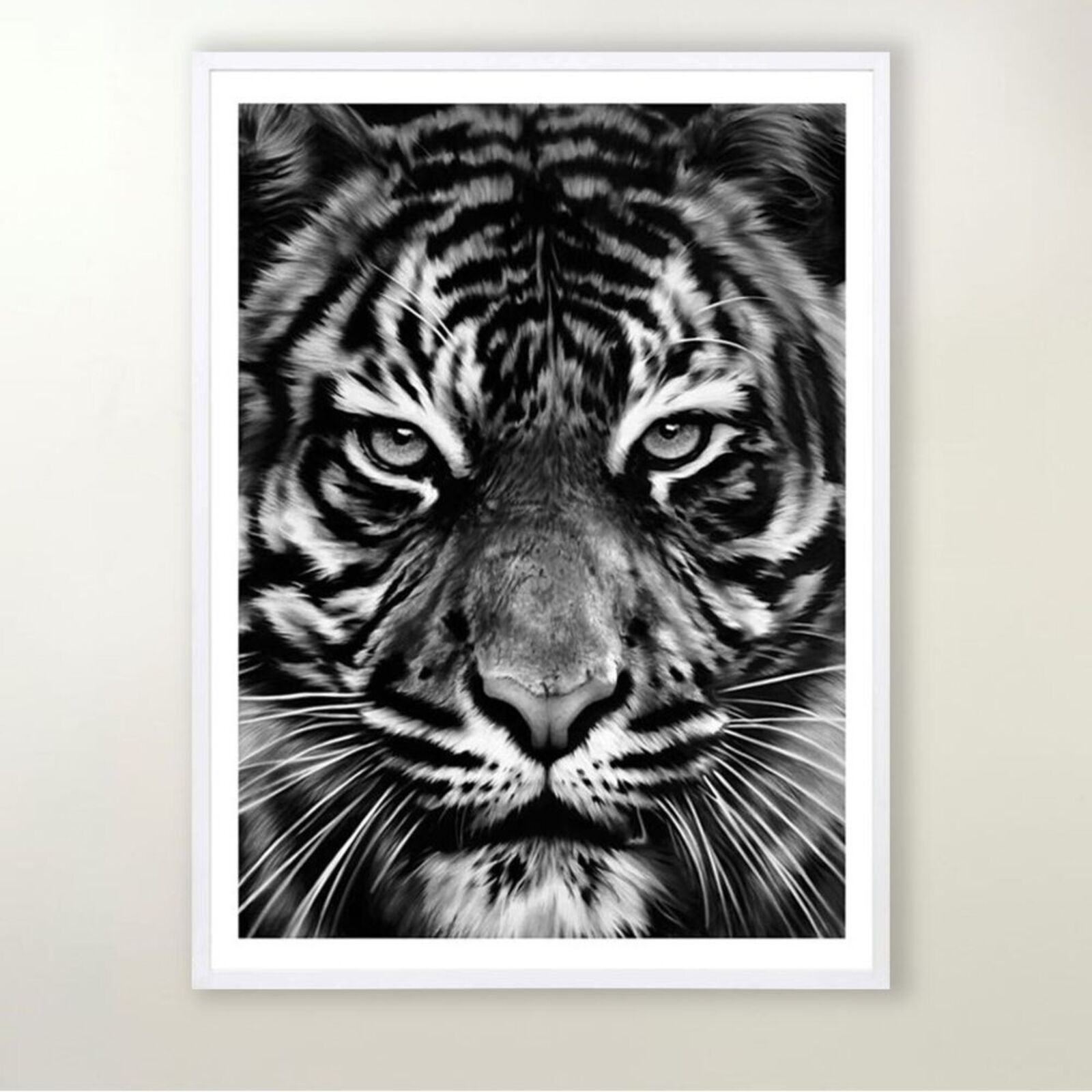 a black and white photo of a tiger's face