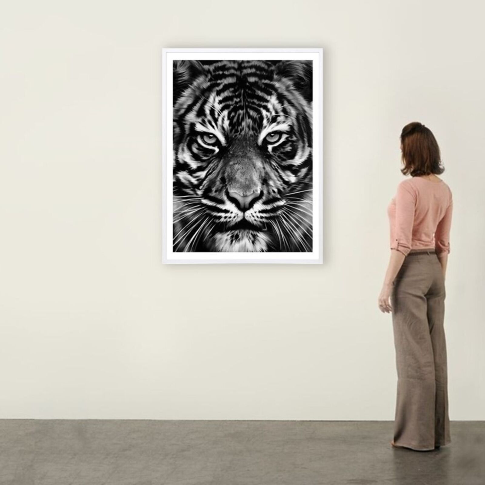a black and white photo of a tiger's face