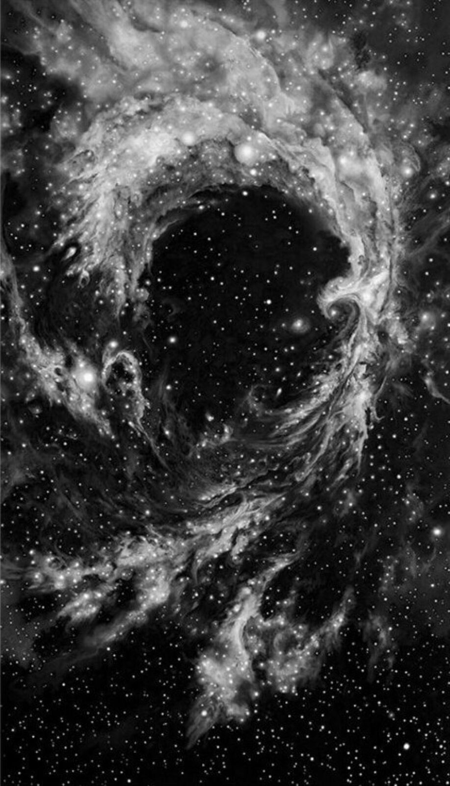 a black and white image of a spiral galaxy