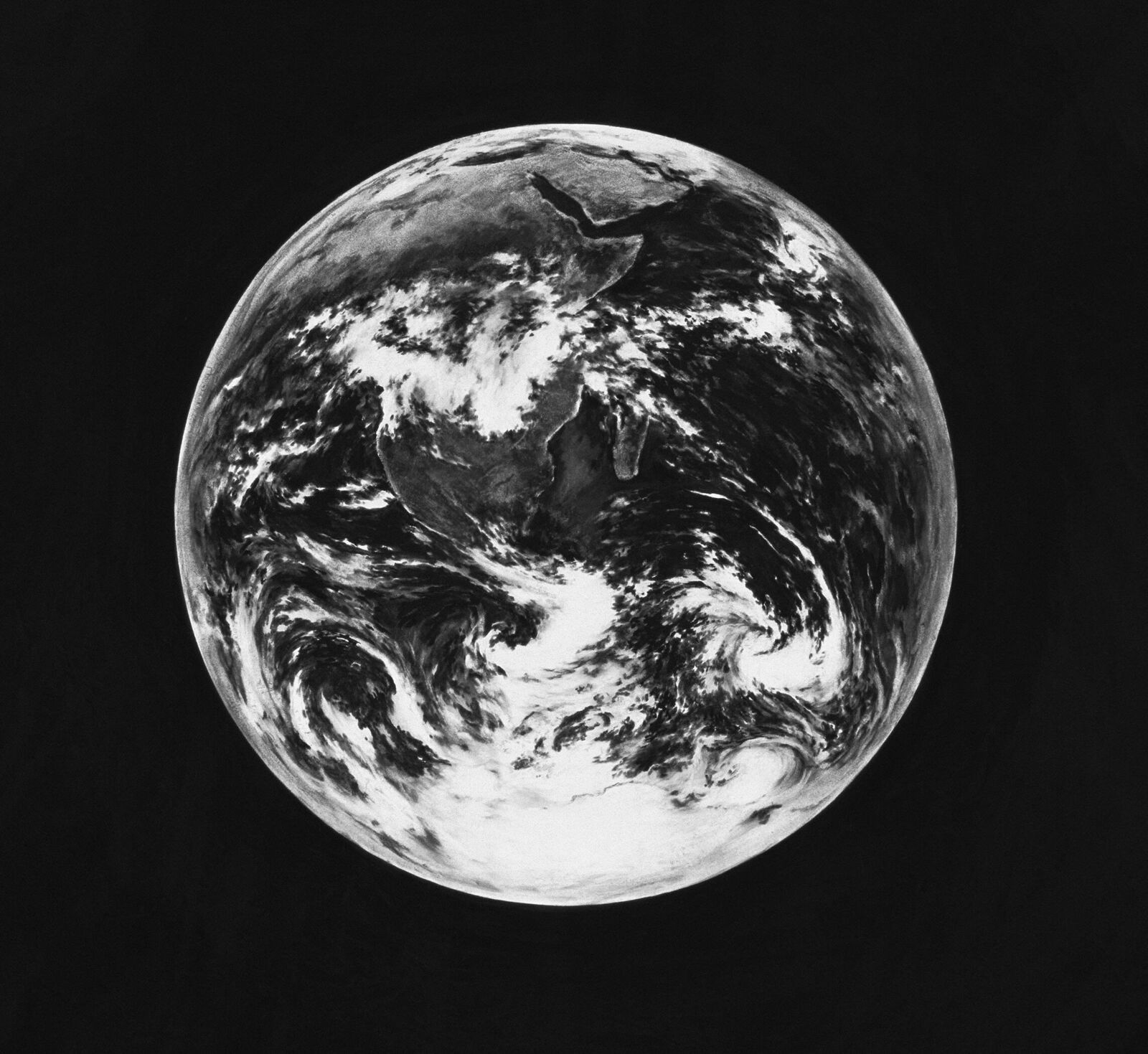 A black and white photo of the earth.