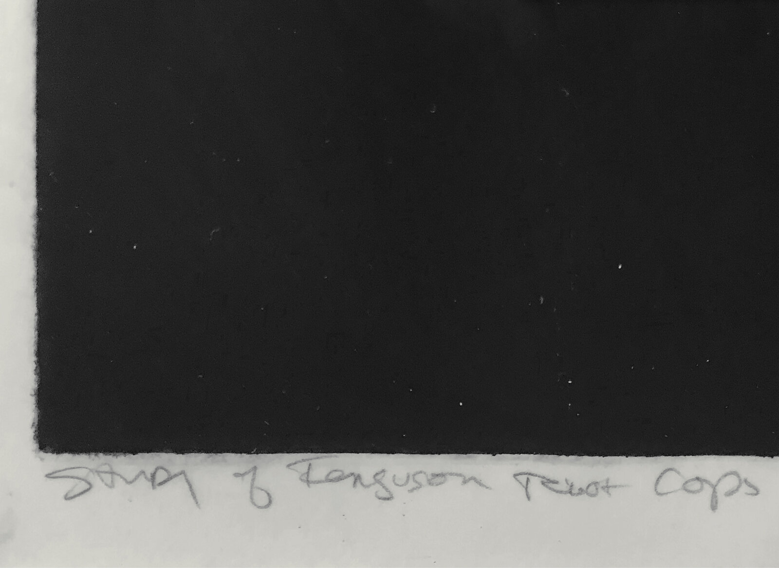 A black and white photo of a group of police officers in riot gear.