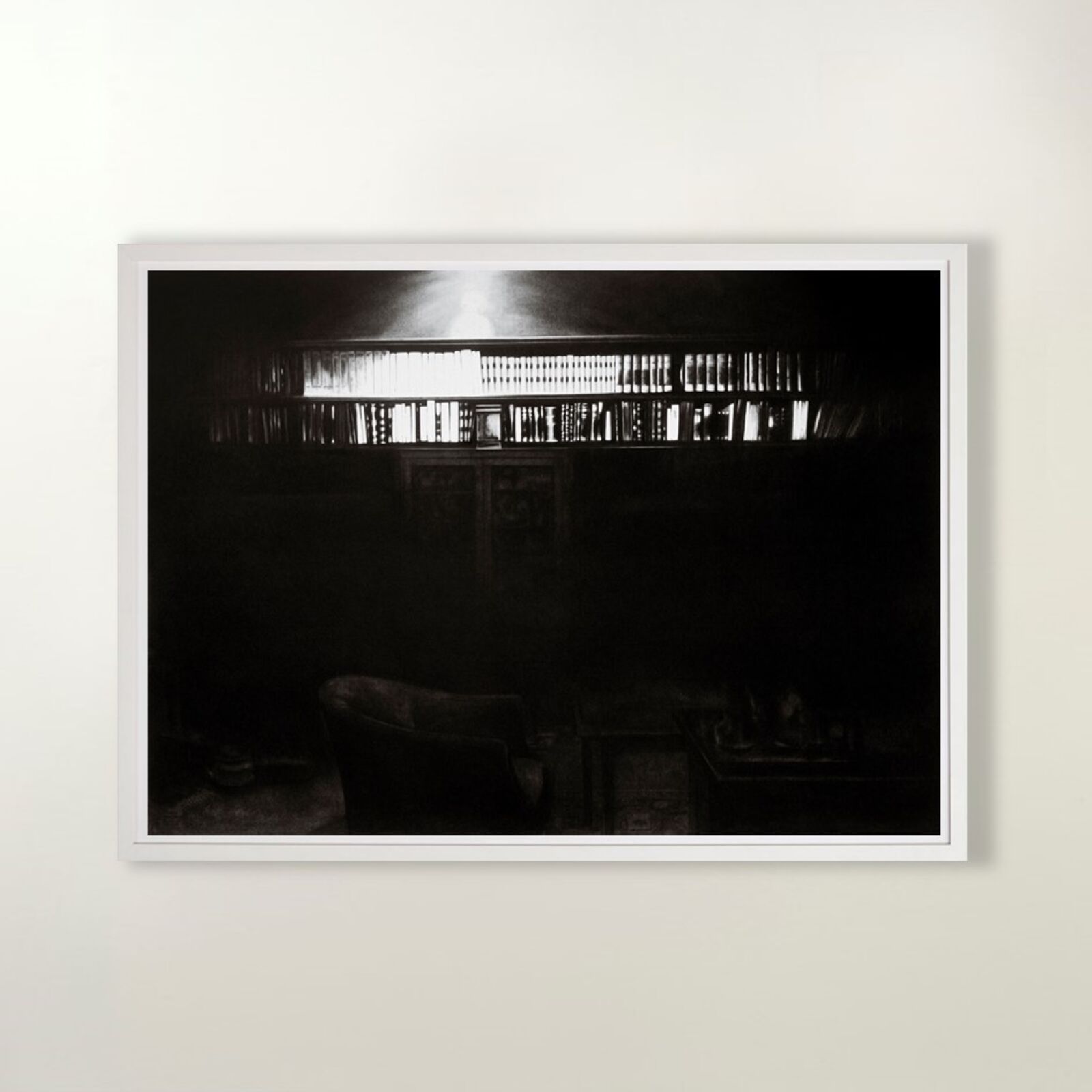 A gallery wall of black and white framed photographs showcasing interior details.