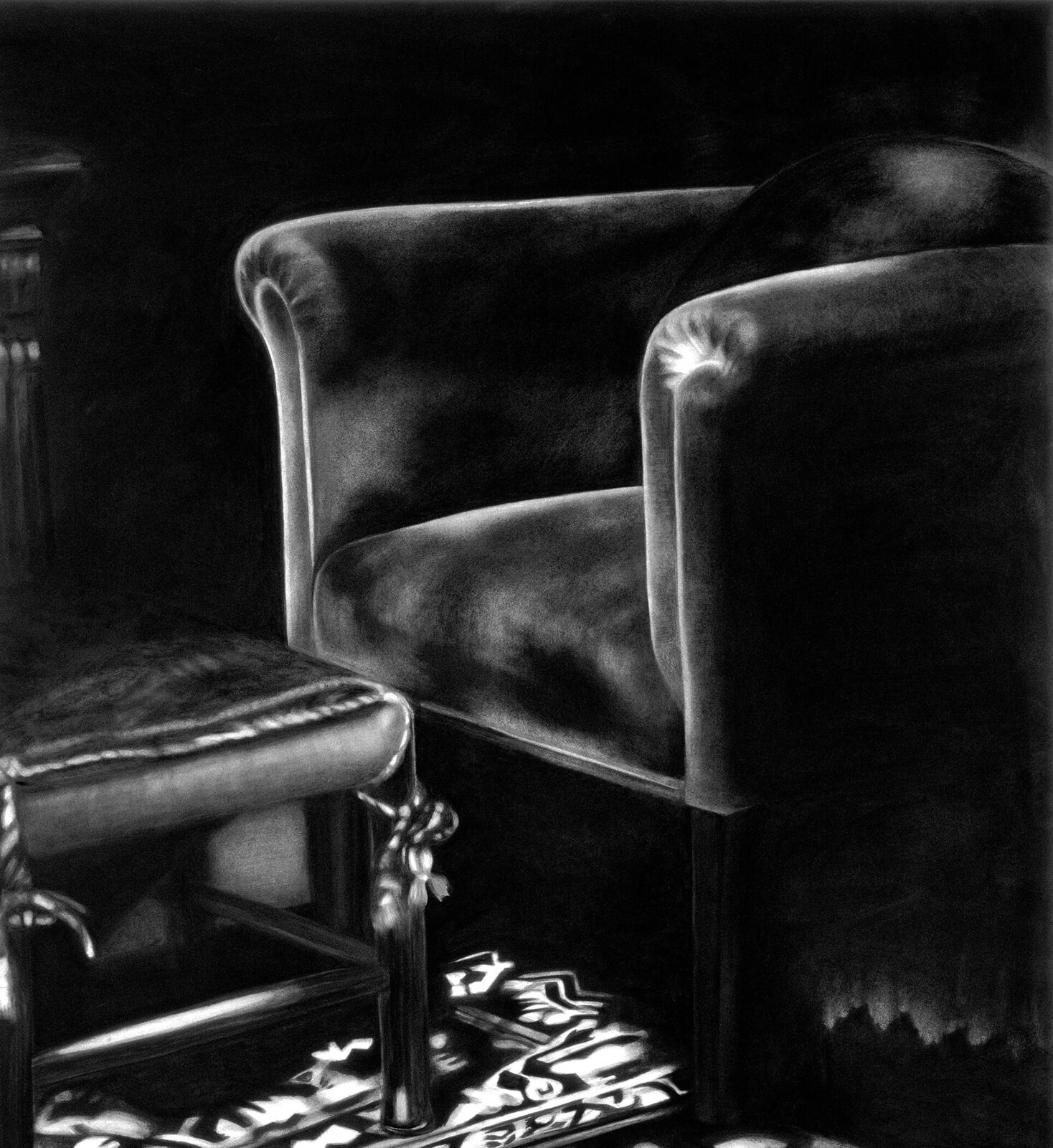 A gallery wall of black and white framed photographs showcasing interior details.