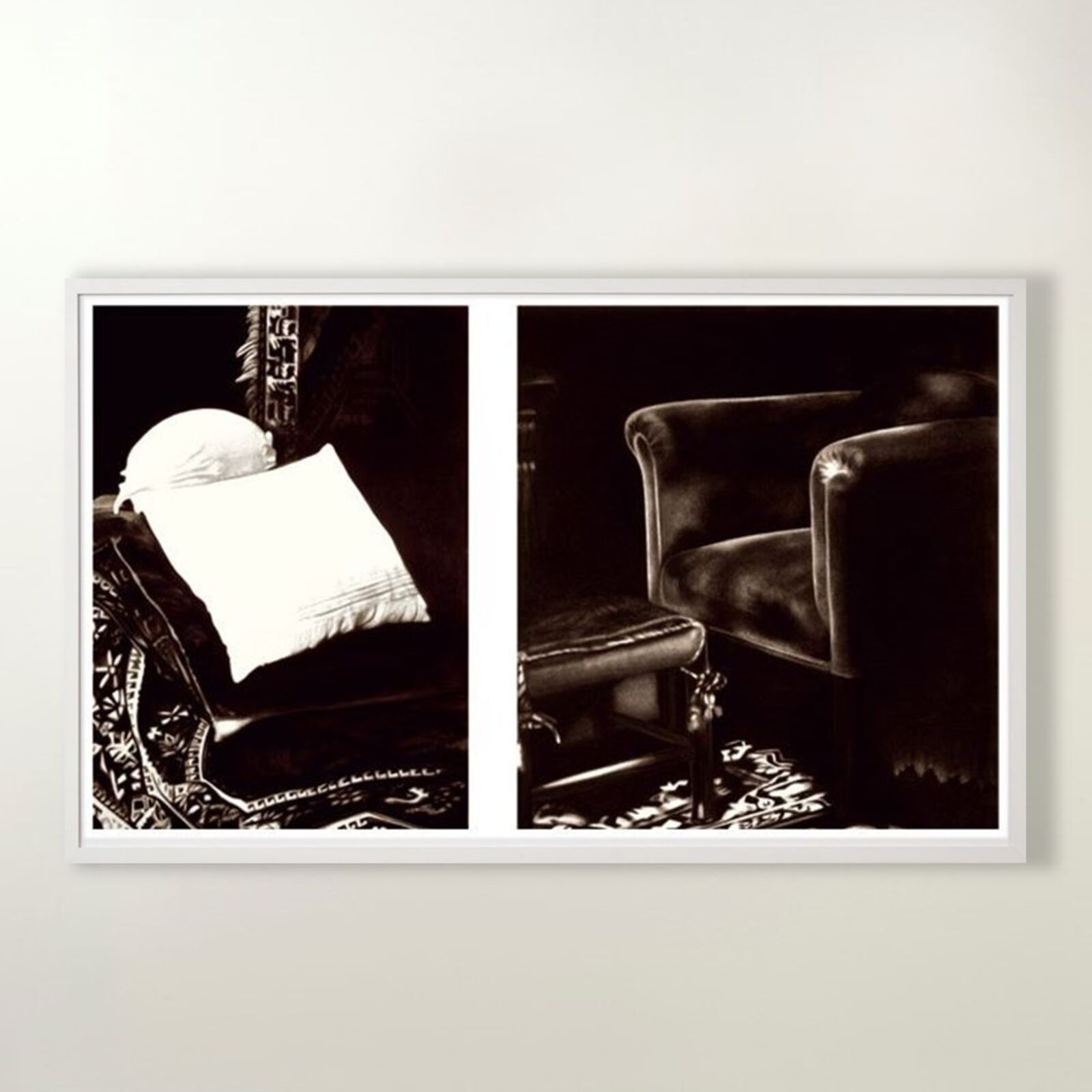 A gallery wall of black and white framed photographs showcasing interior details.