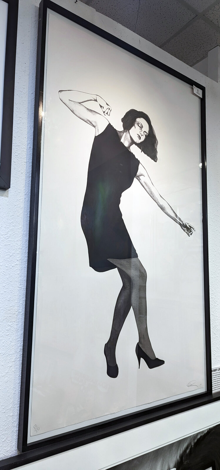 A dynamic black-and-white drawing of a figure in motion, captured mid-dance with expressive energy.
