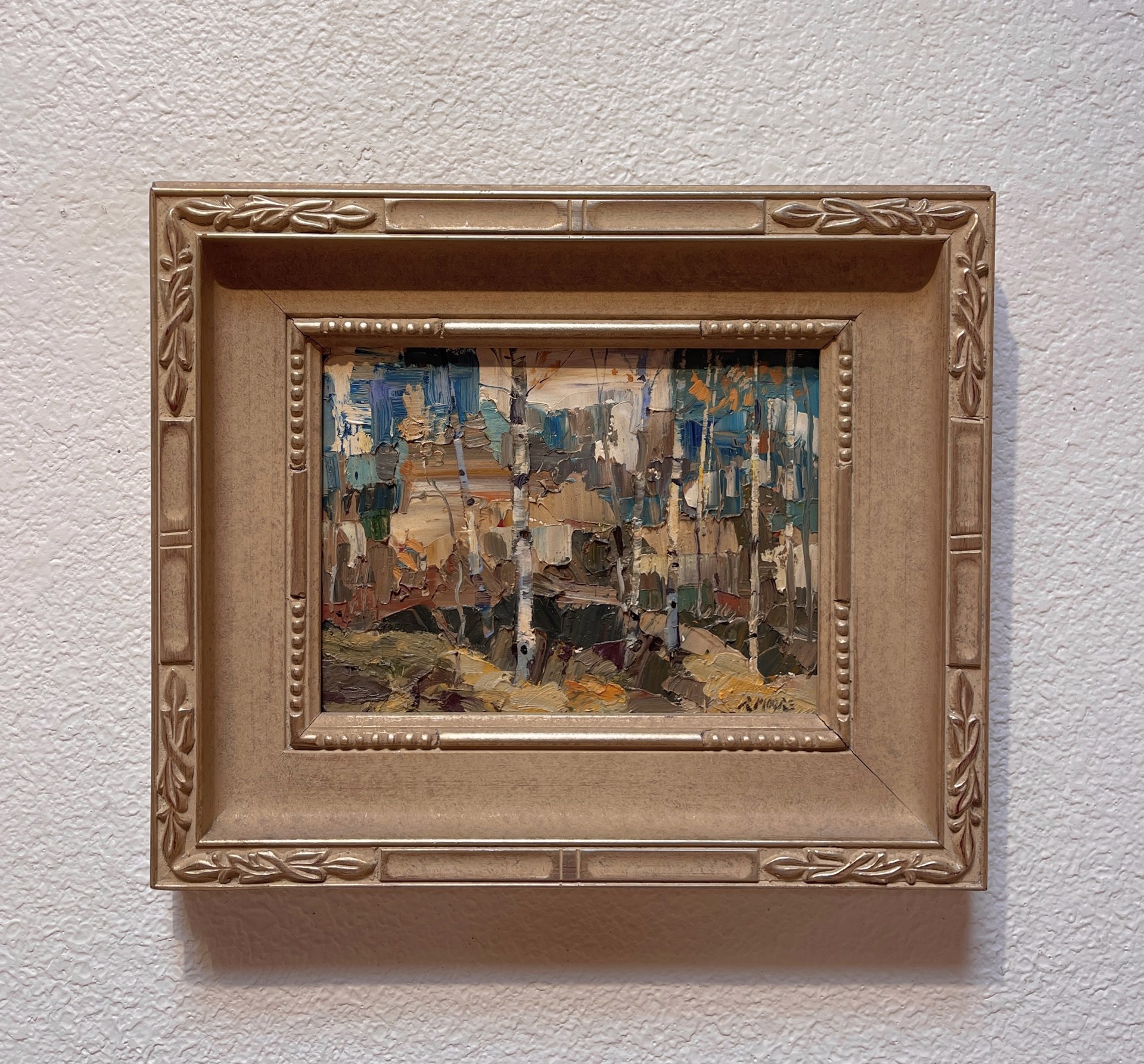 A painting of a forest with trees in the background.