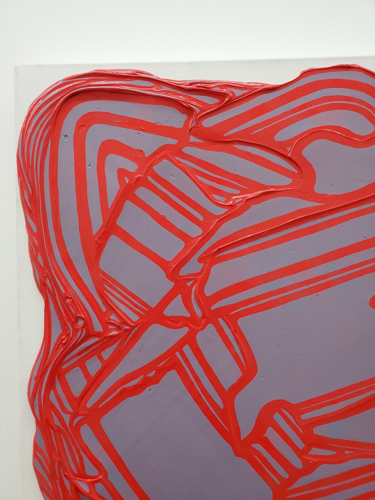 A textured abstract piece featuring a red, organic network over a translucent purple background.
