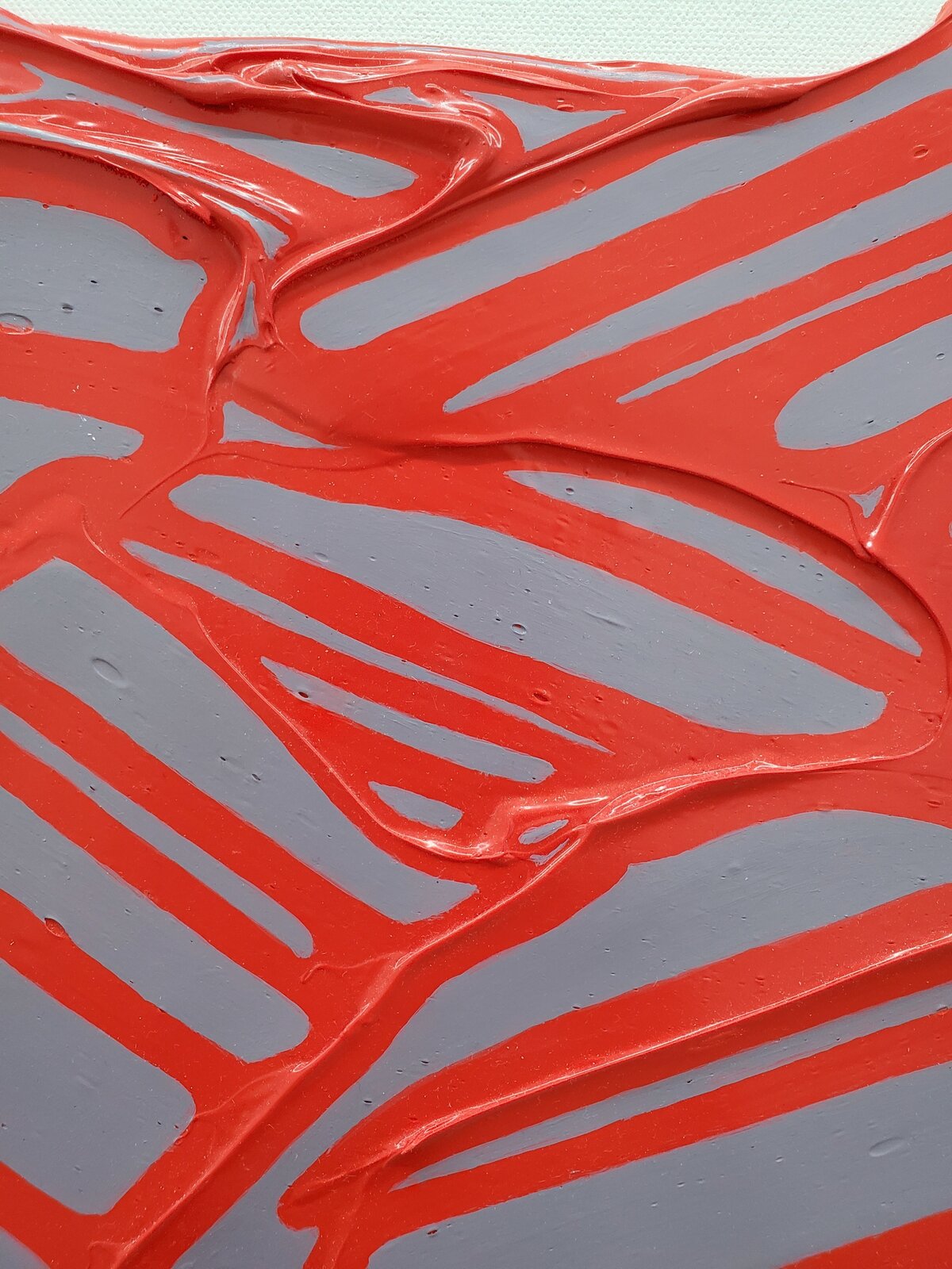 A textured abstract piece featuring a red, organic network over a translucent purple background.