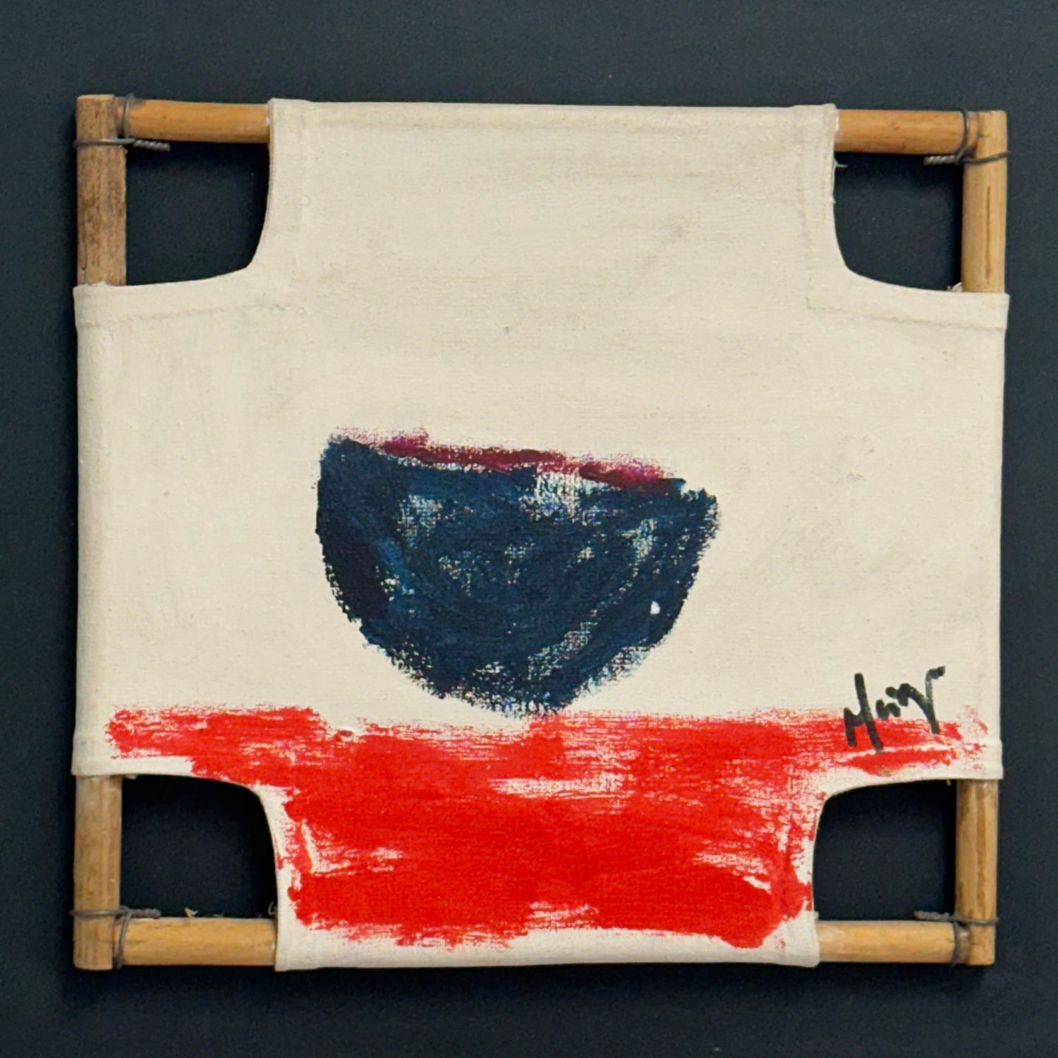 A painting on a canvas with a wooden frame on a black wall.