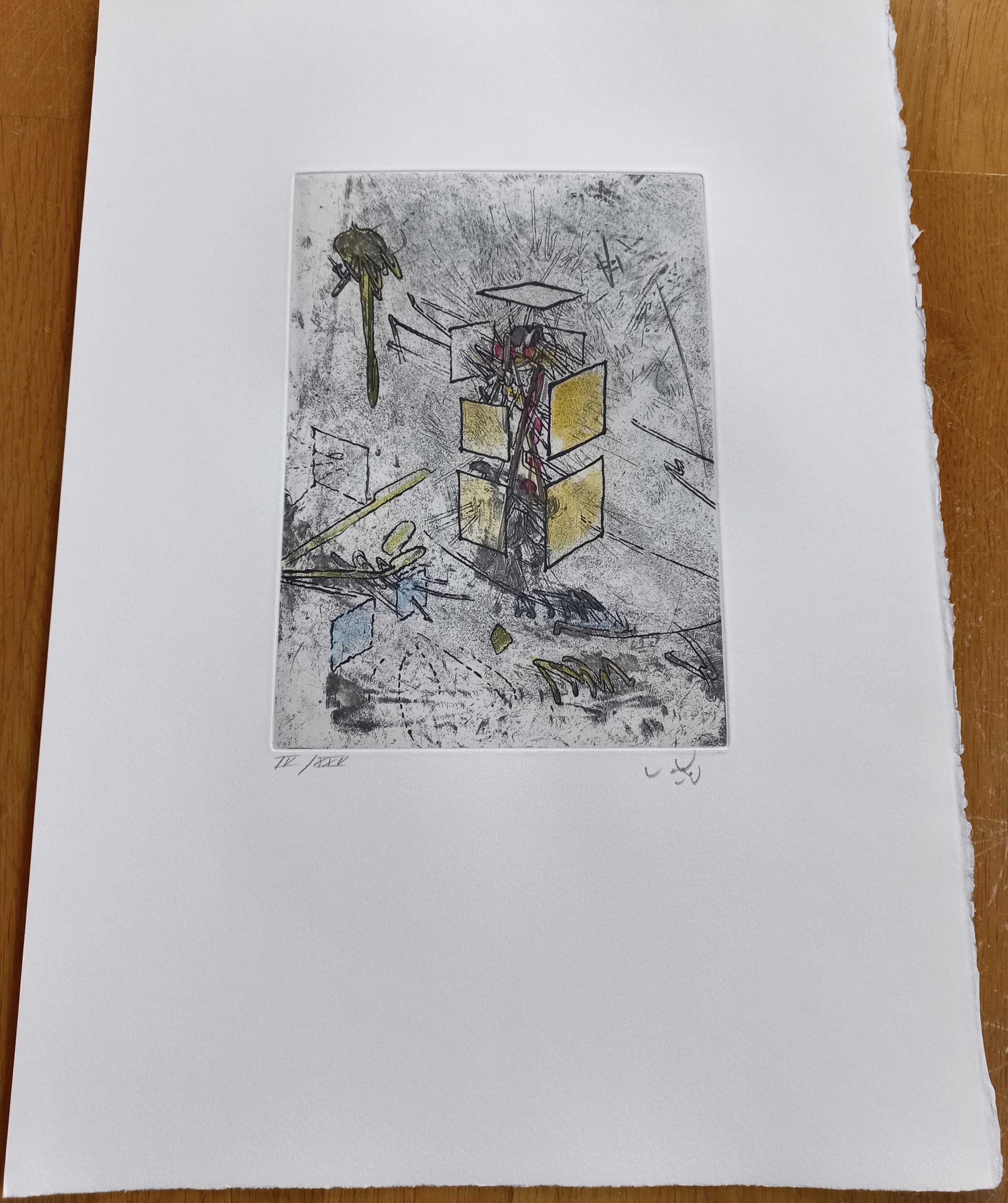 A piece of paper with a drawing on it on a table.