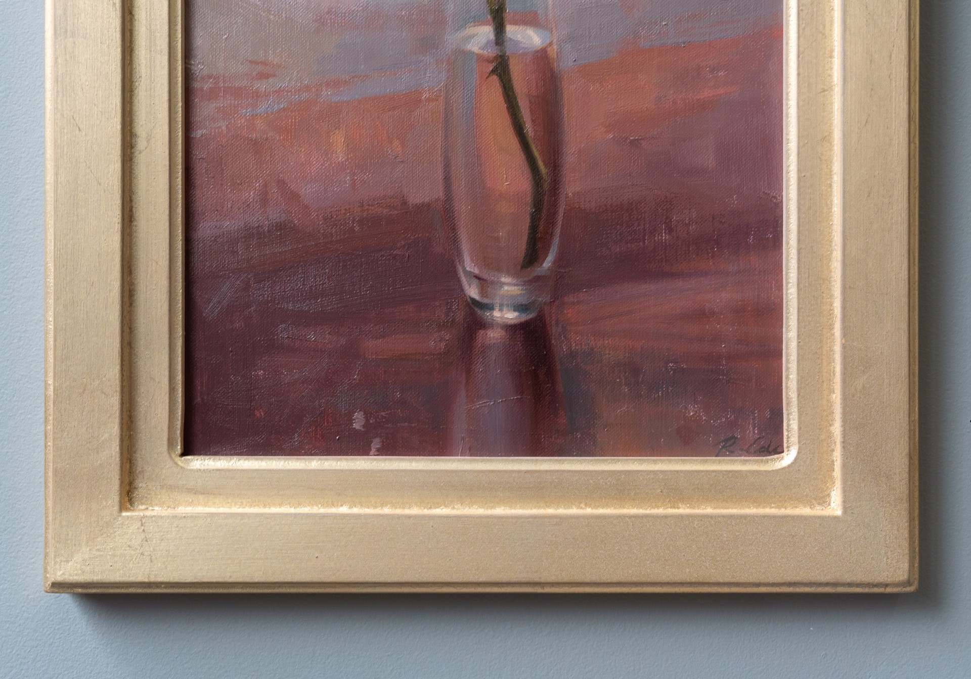 A soft, impressionistic still life of a single rose in a glass vase.