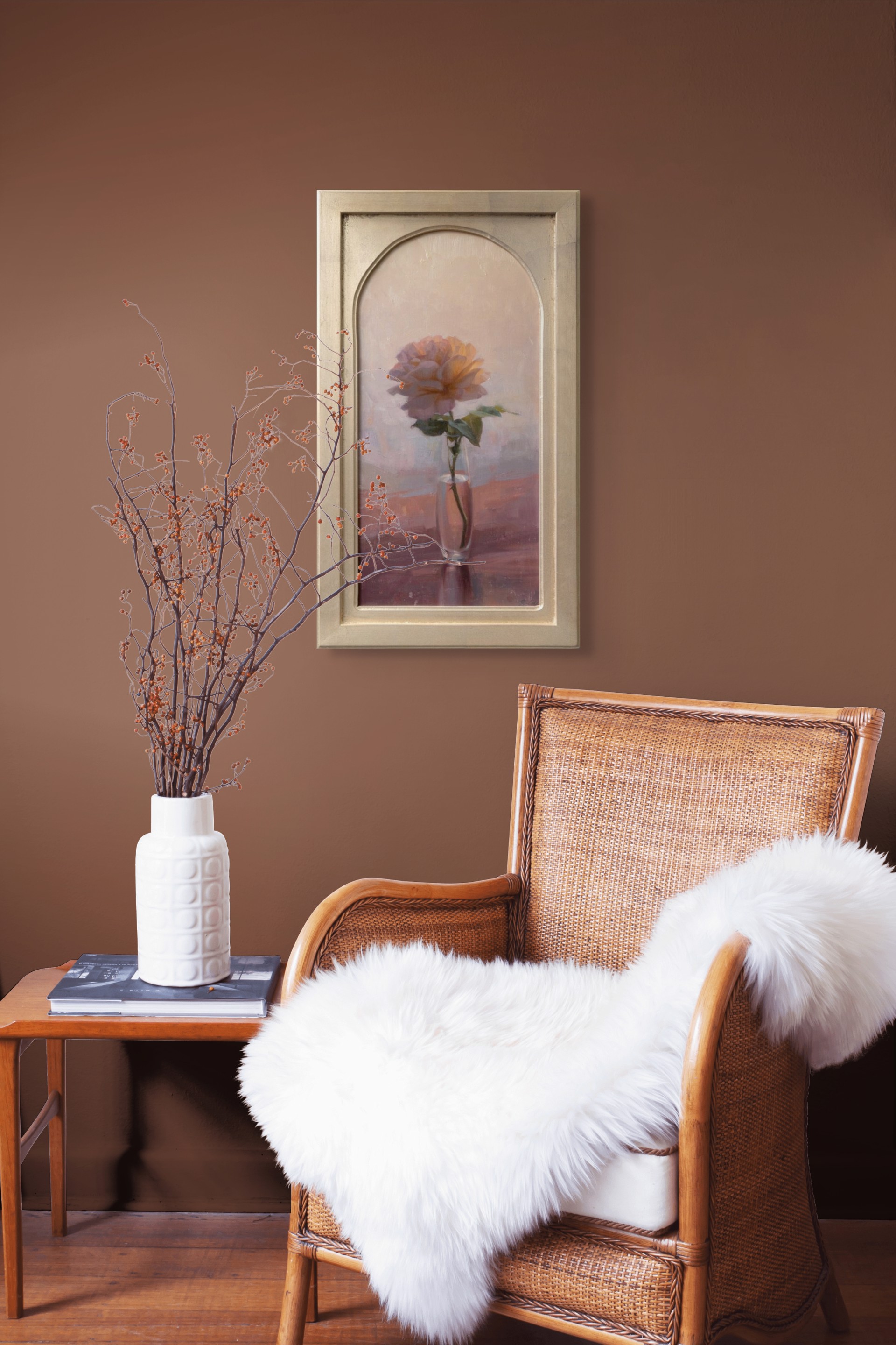 A soft, impressionistic still life of a single rose in a glass vase.