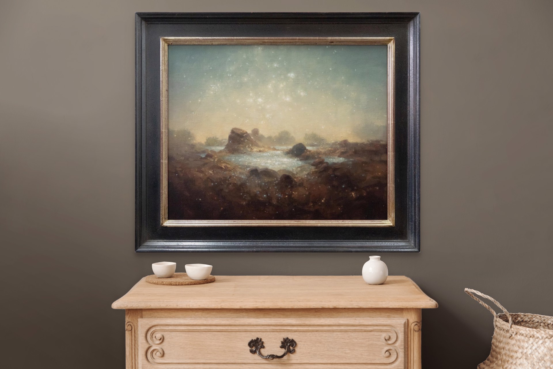A painting of a rocky landscape with a starry sky.
