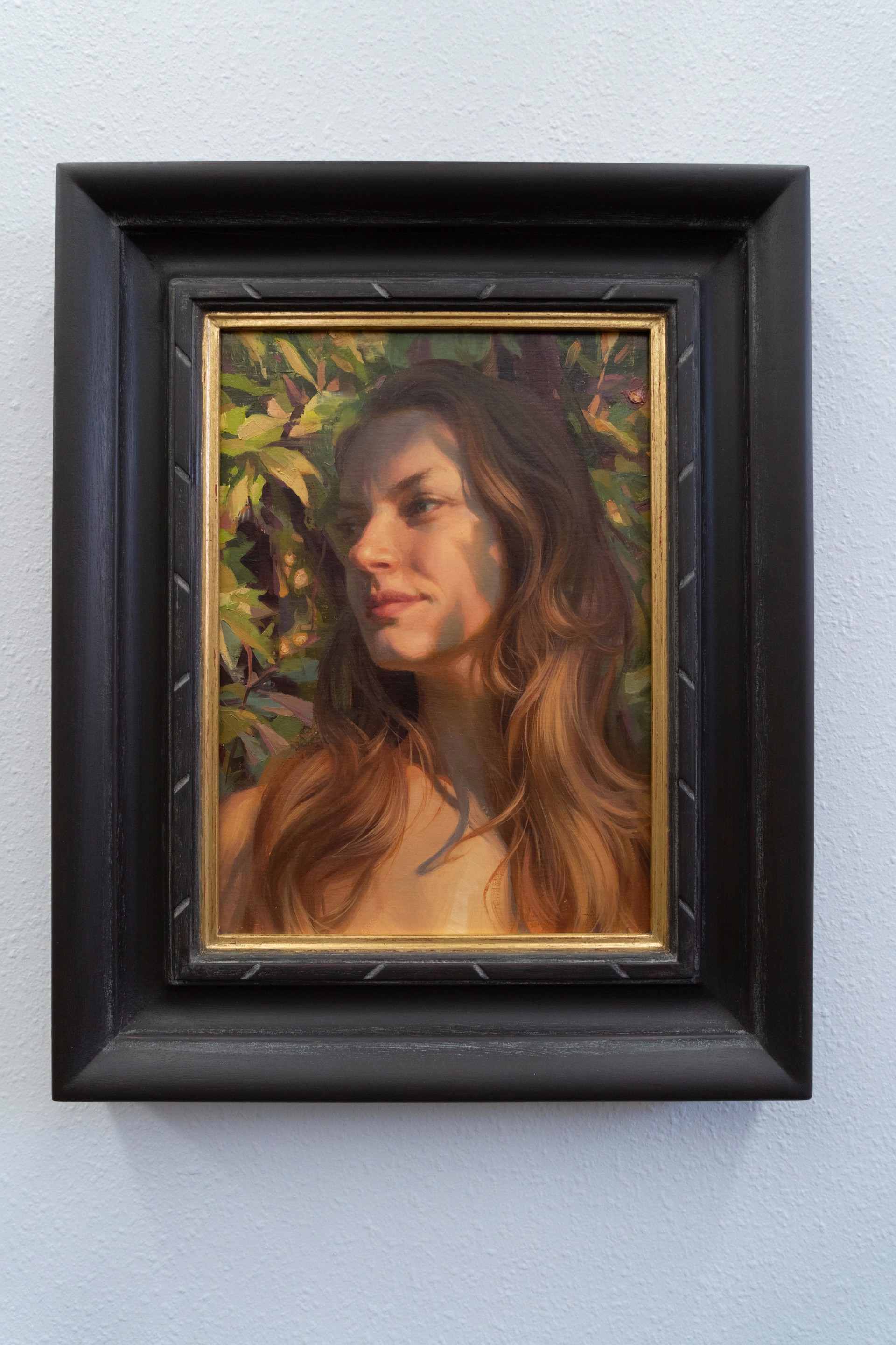 A painting of a woman with long brown hair.