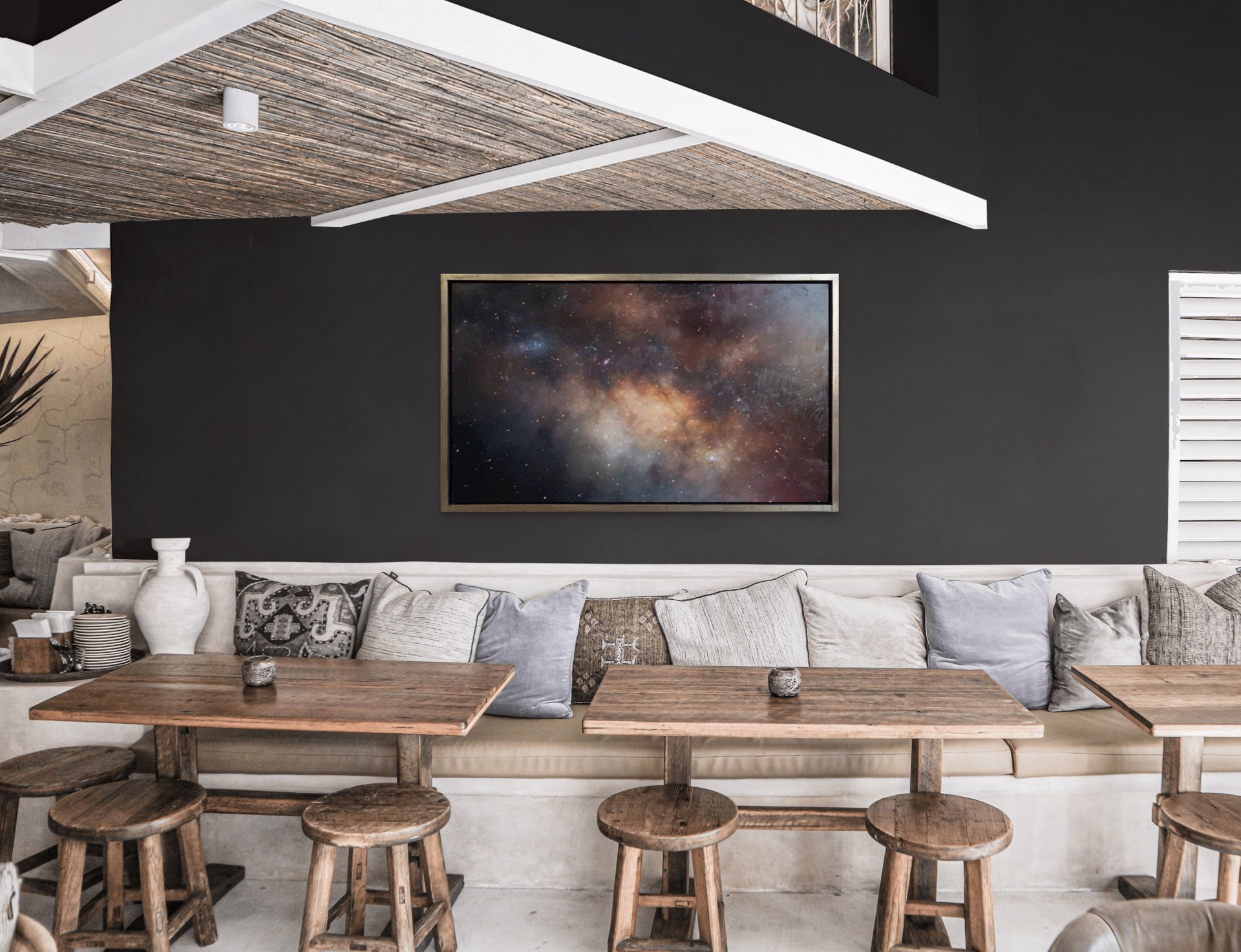 A cosmic nebula scene featuring a glowing central cloud surrounded by dark space and scattered stars.