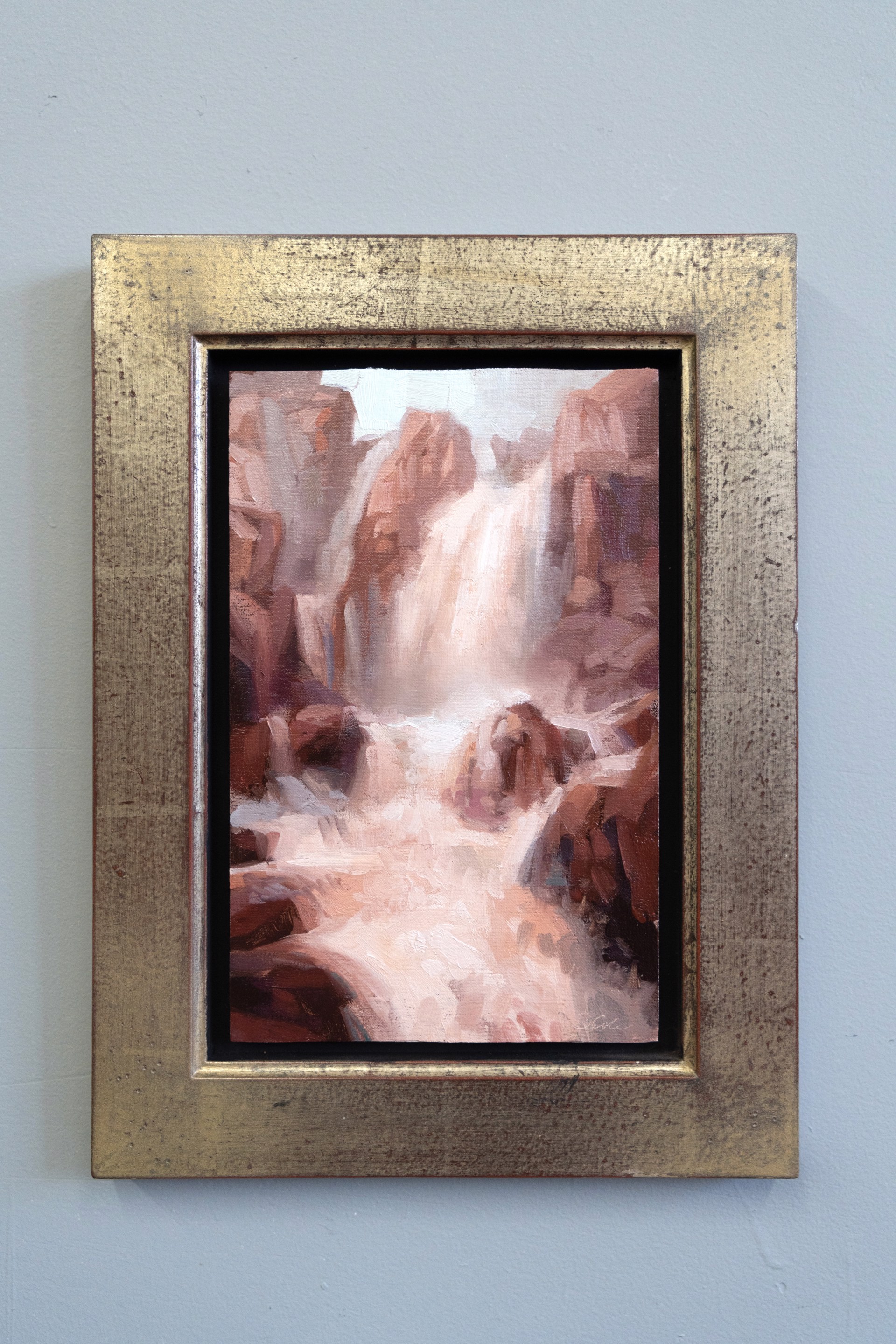 A painterly landscape of a waterfall cascading through reddish rock formations.