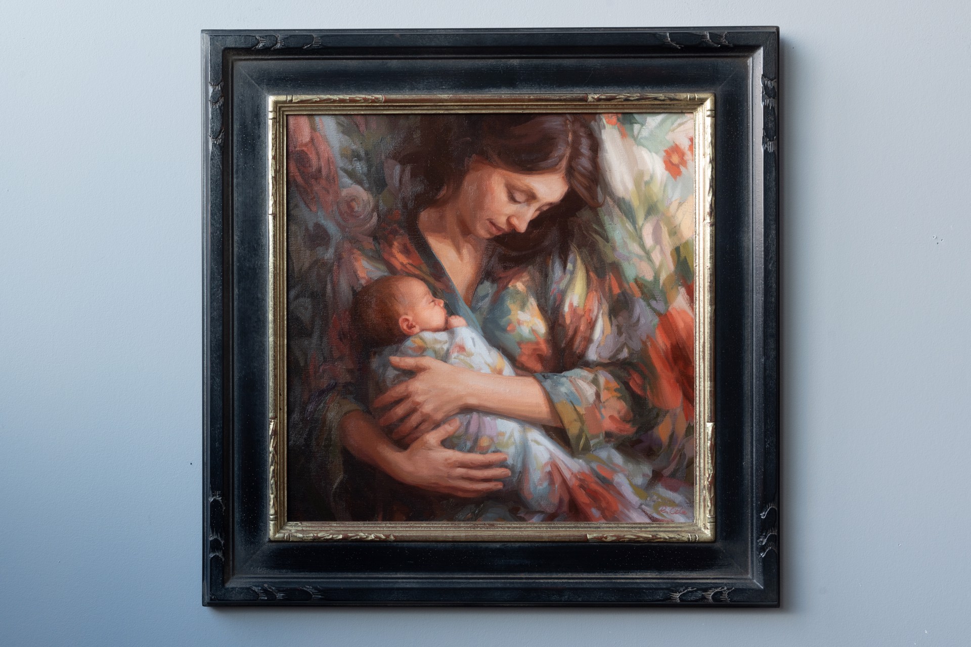 A painting of a woman holding a baby in her arms.