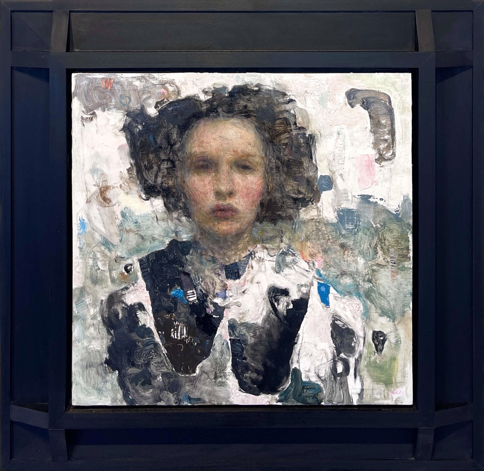 A portrait of a person with dark curly hair and a black vest against an abstract background.